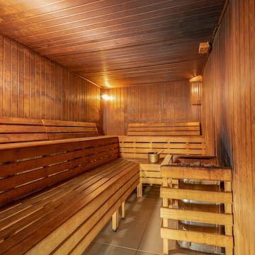 a wooden sauna with a bucket and bucket