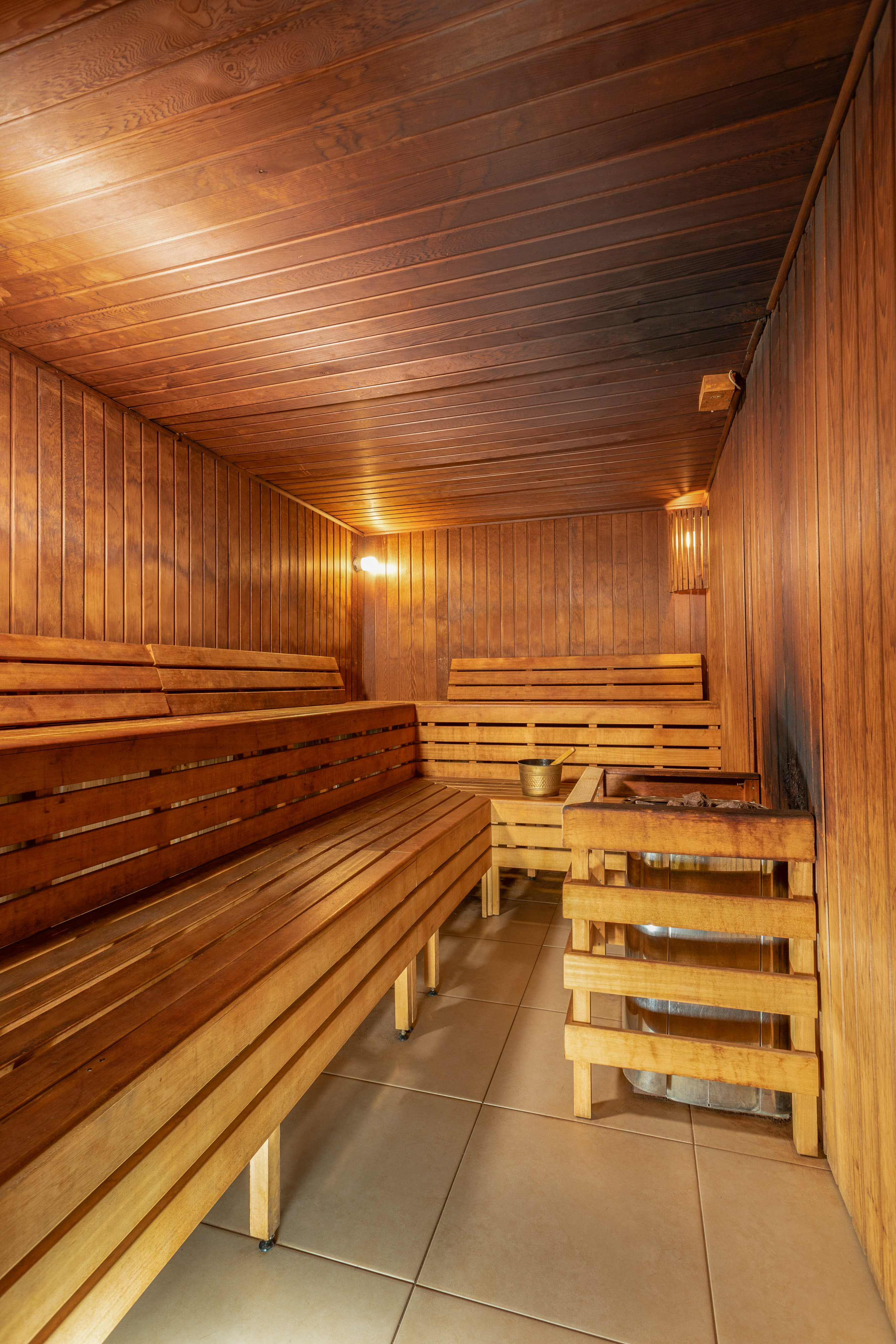 a wooden sauna with a bucket and bucket