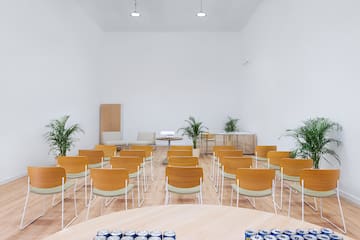 a room with chairs and tables