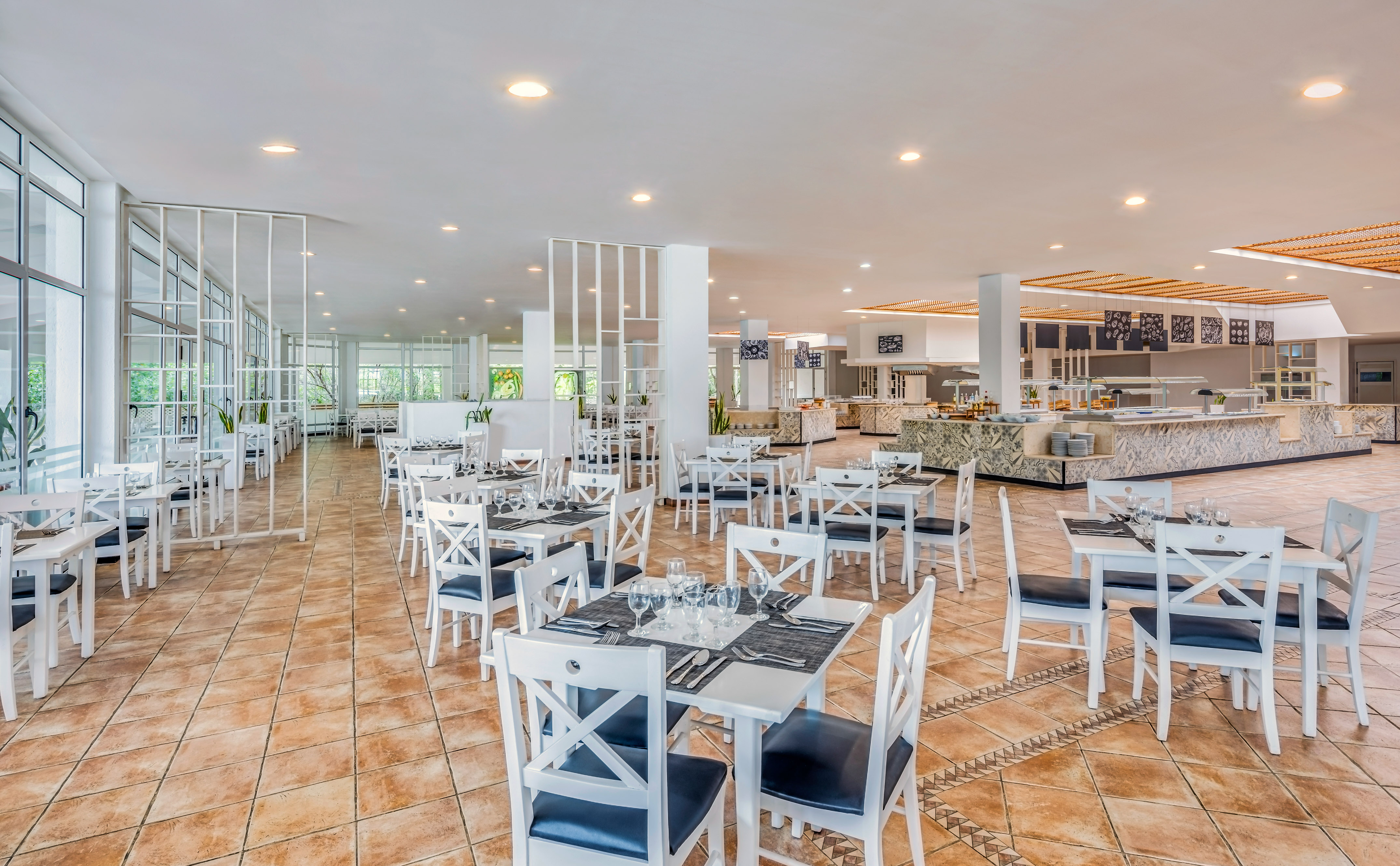 a restaurant with tables and chairs