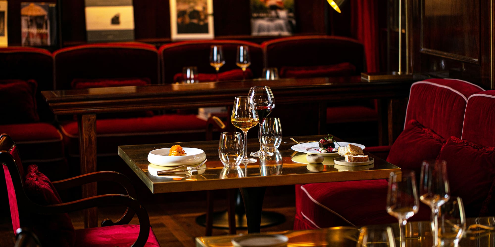 a table with wine glasses and food on it