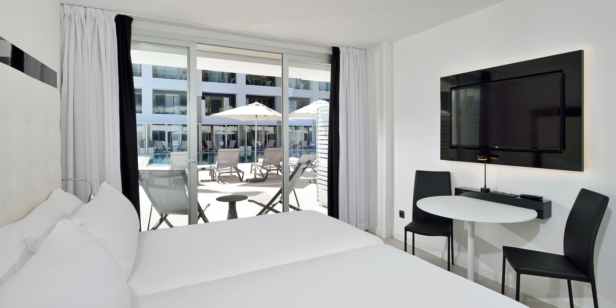 a room with a television and chairs