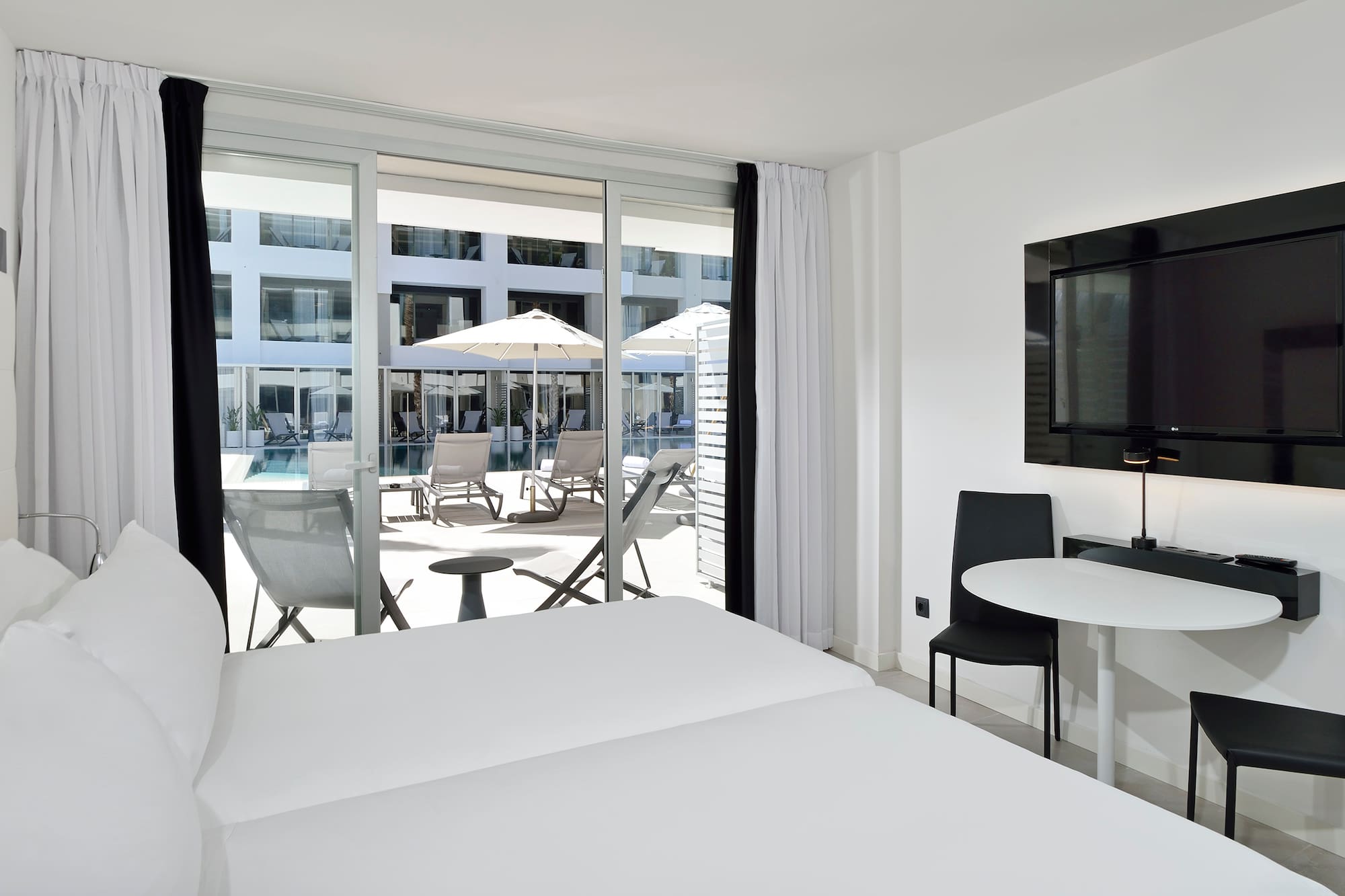 a room with a television and chairs