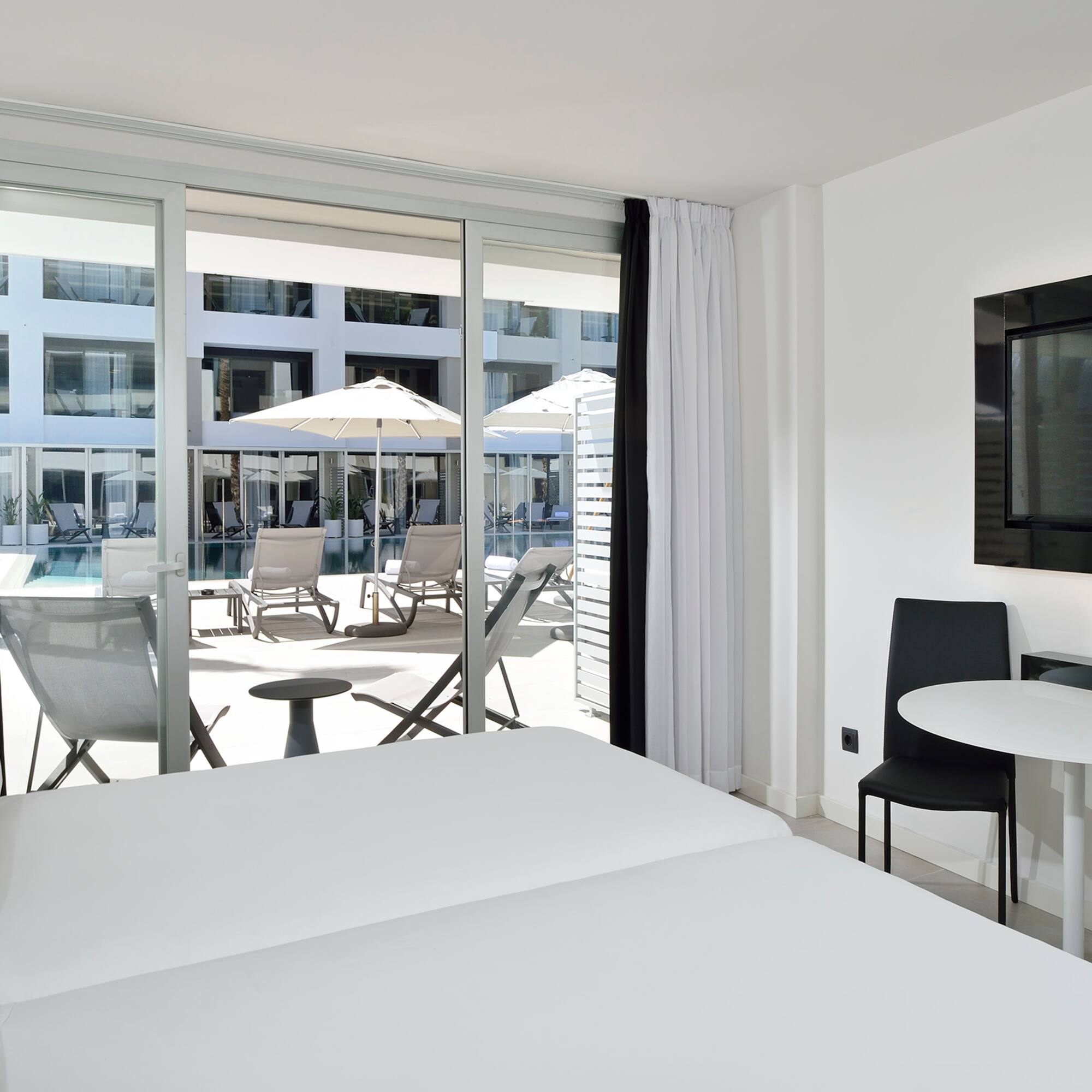 a room with a television and chairs