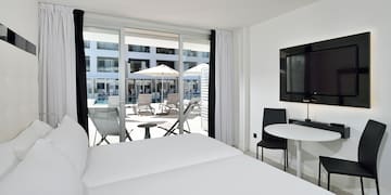 a room with a television and chairs