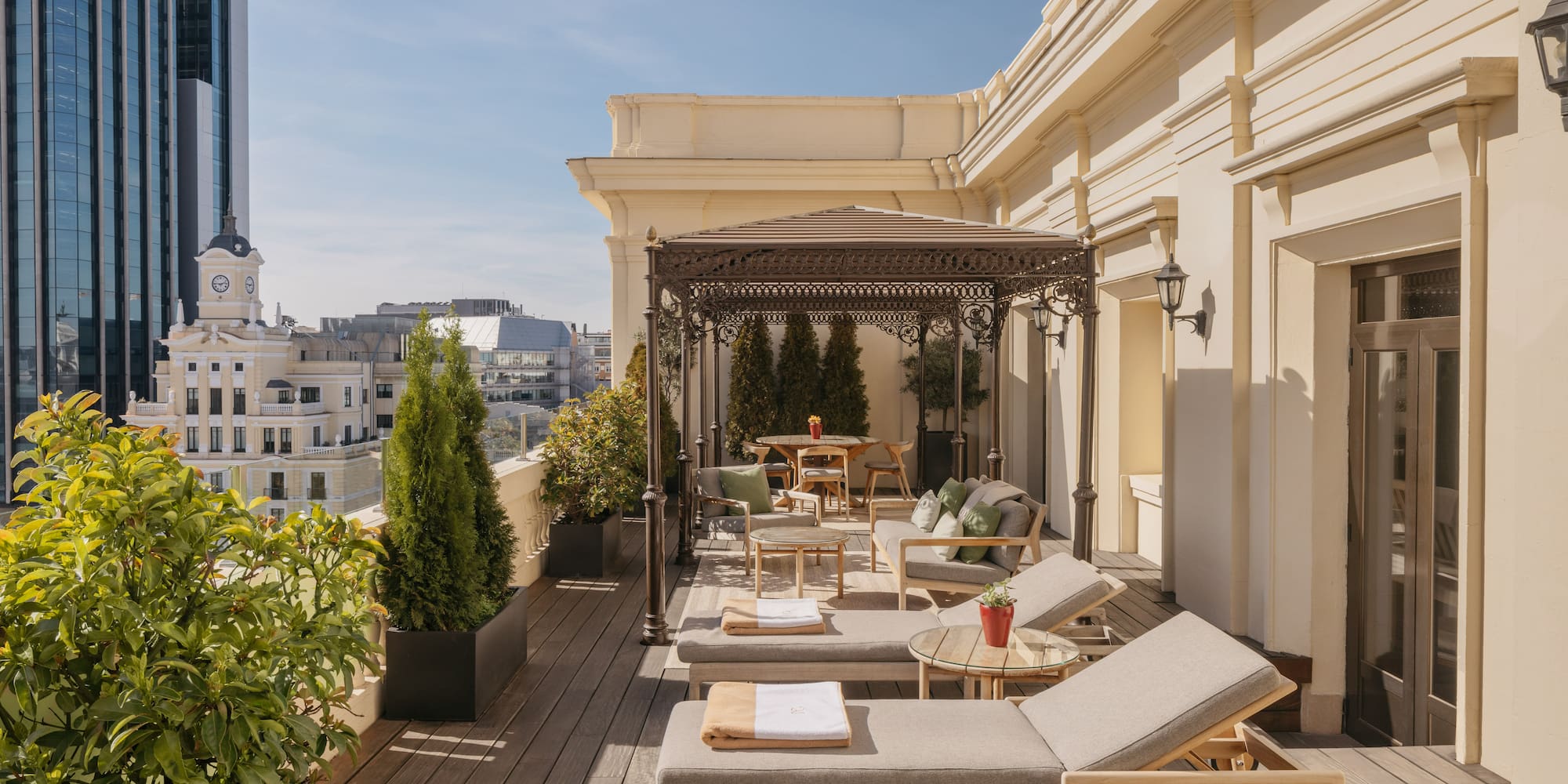 a patio with chairs and tables on a deck
