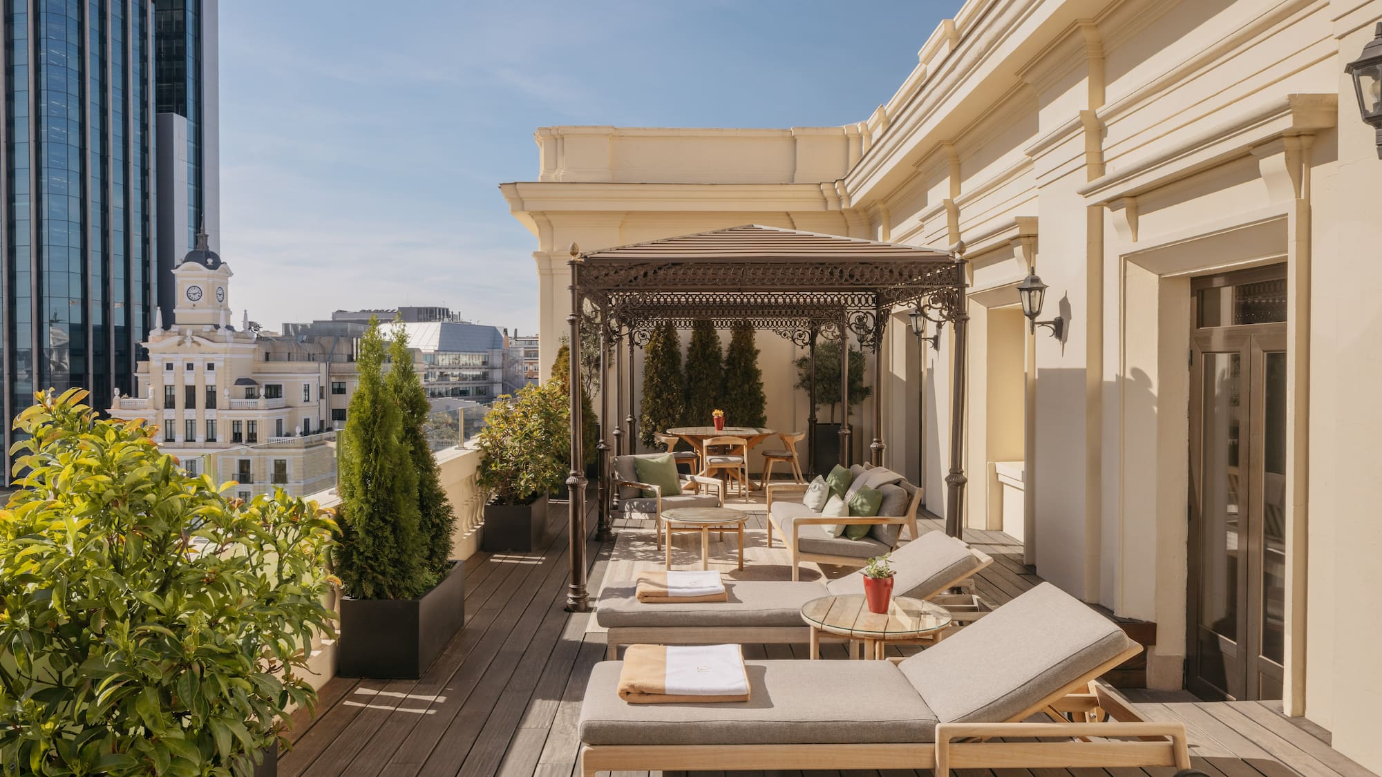 a patio with chairs and tables on a deck