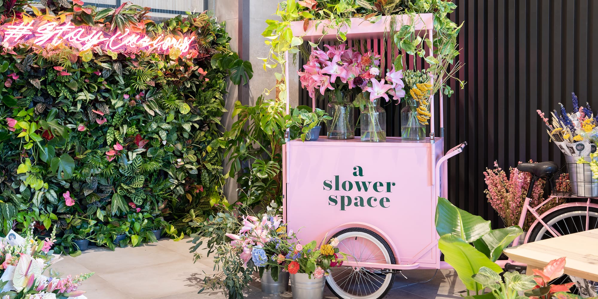 a pink cart with flowers on it