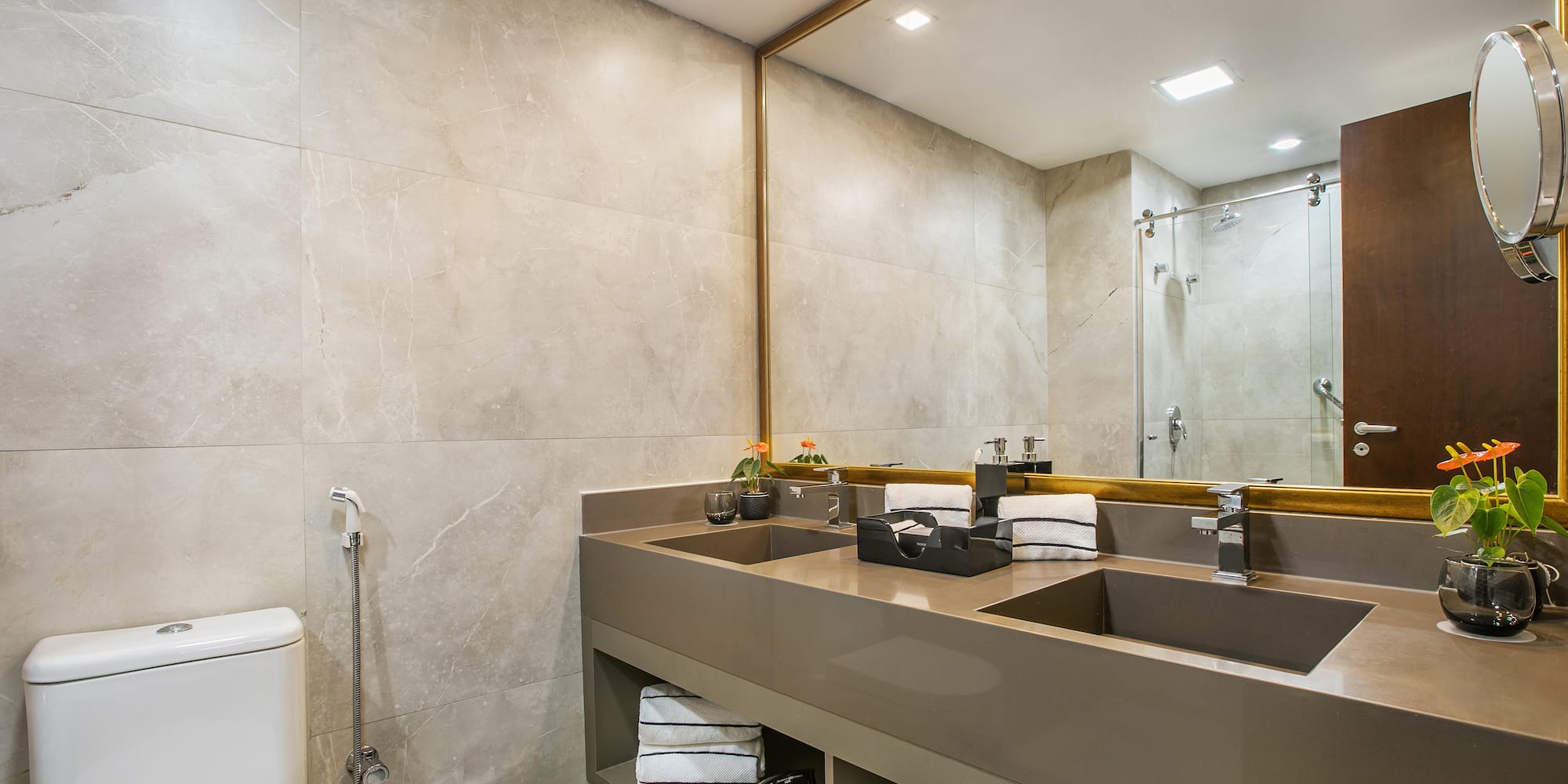 a bathroom with a large mirror and sinks