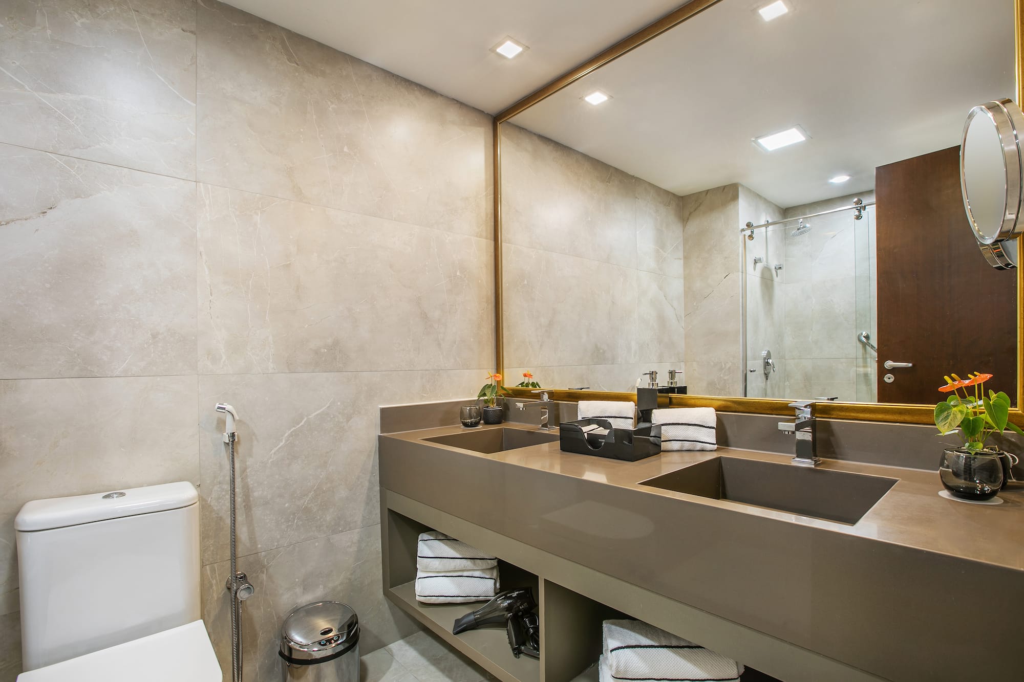 a bathroom with a large mirror and sinks