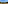 Two mountain bikes overlooking a scenic lake and mountainous landscape.