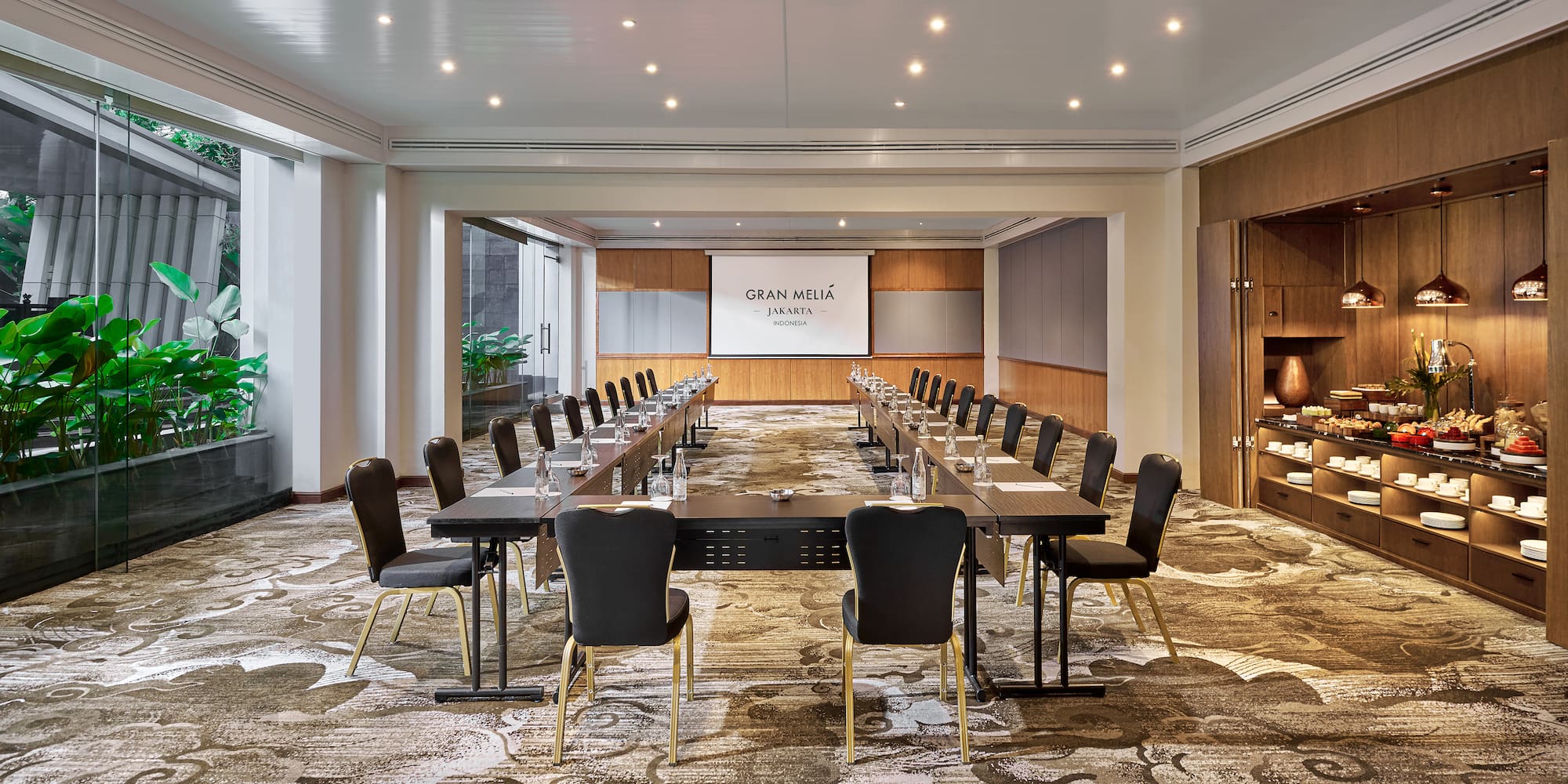 a room with a large table and chairs