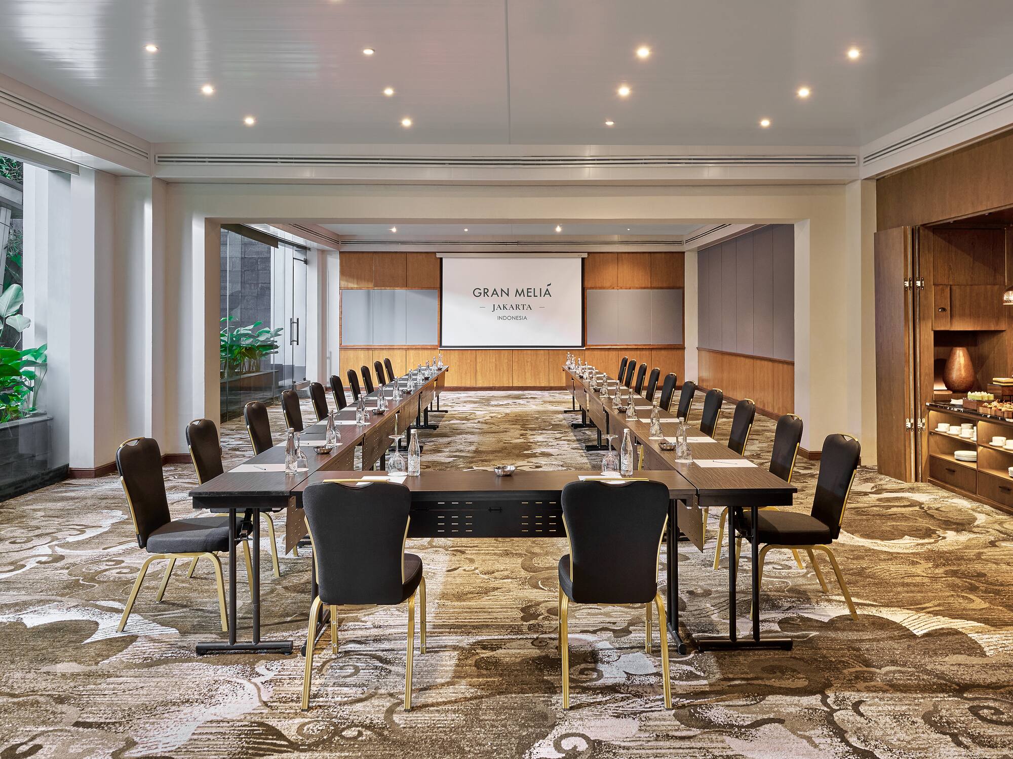 a room with a large table and chairs