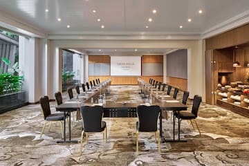 a room with a large table and chairs