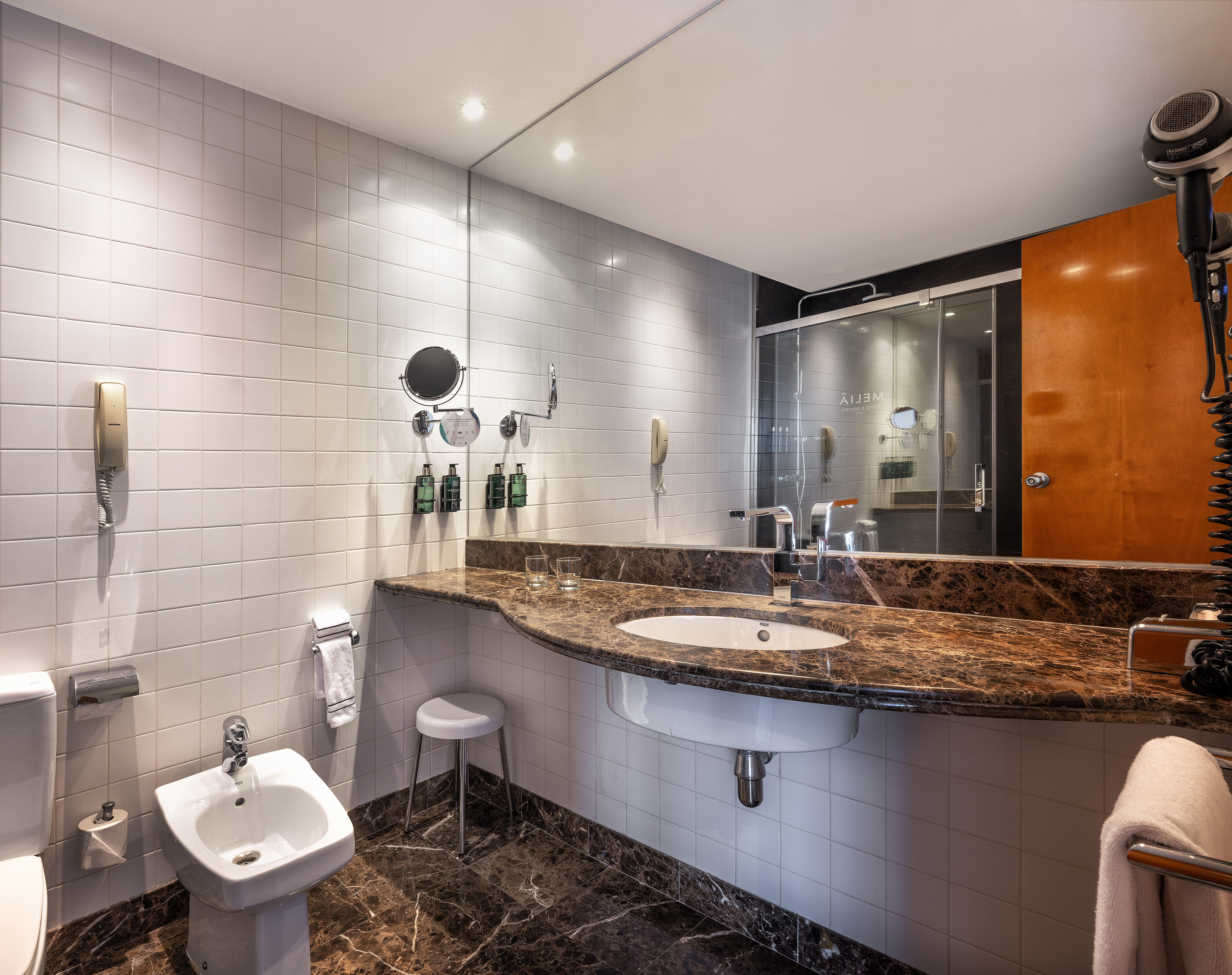 a bathroom with a sink and toilet