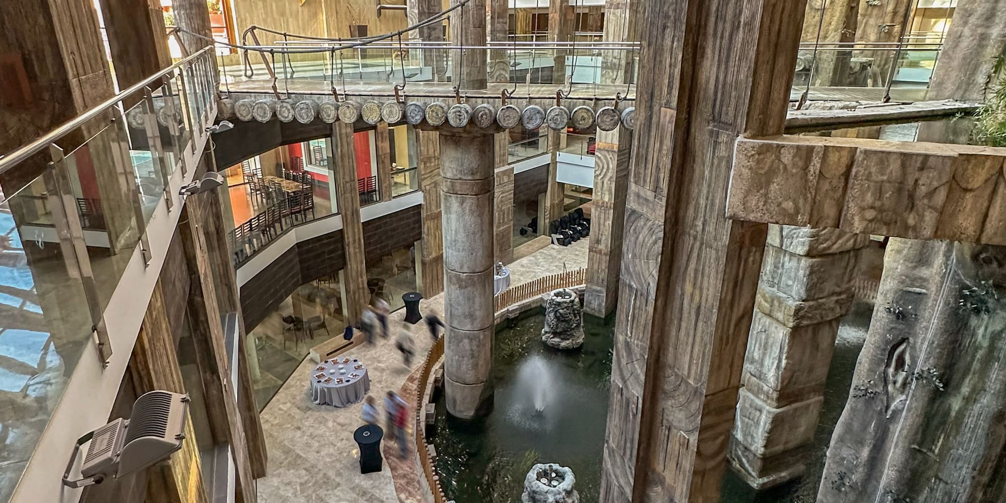 a group of people walking in a mall