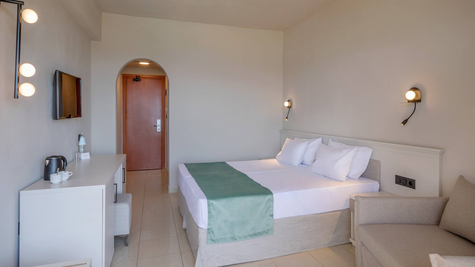 a room with a bed and a chair