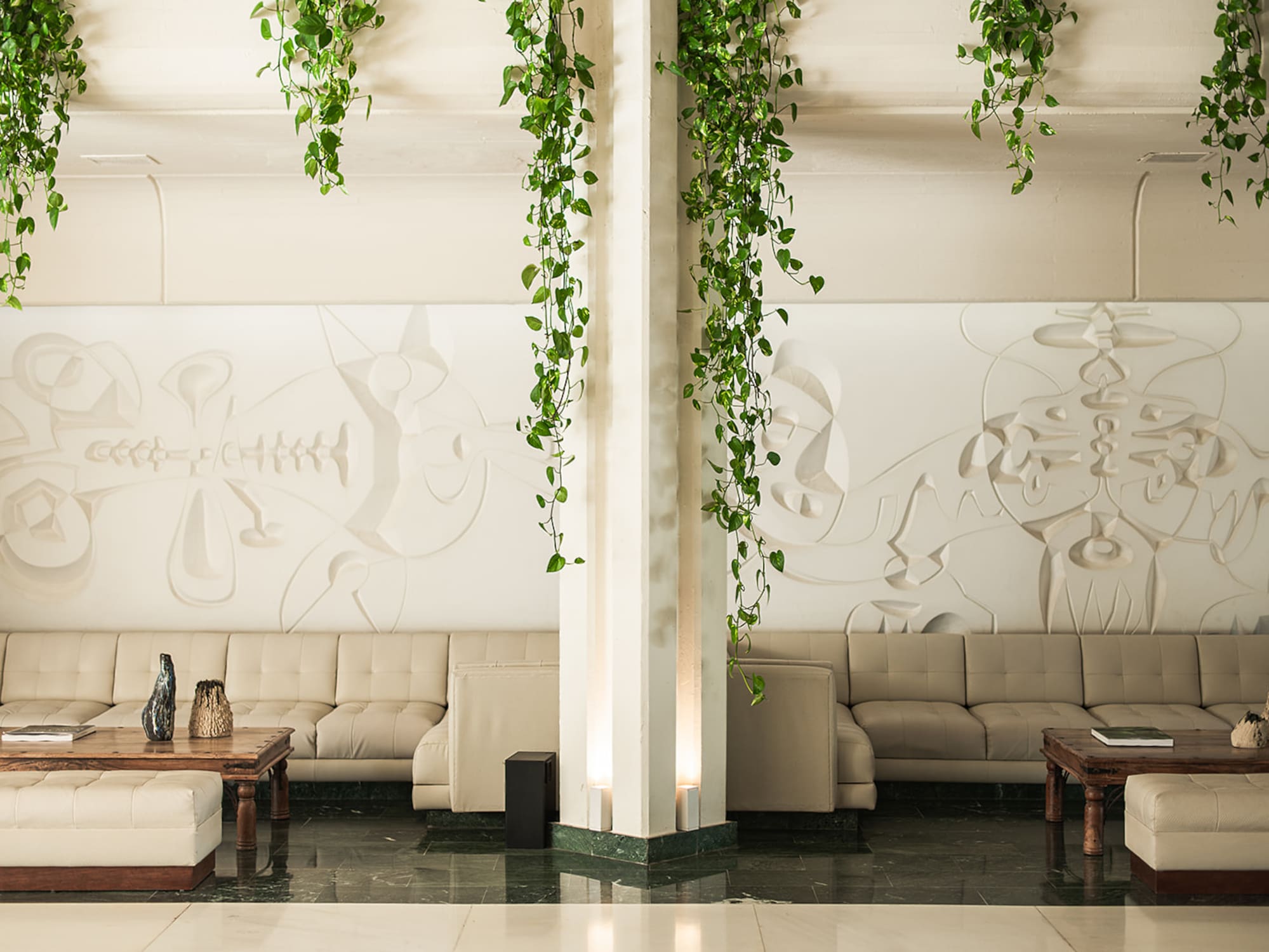 a room with couches and coffee tables