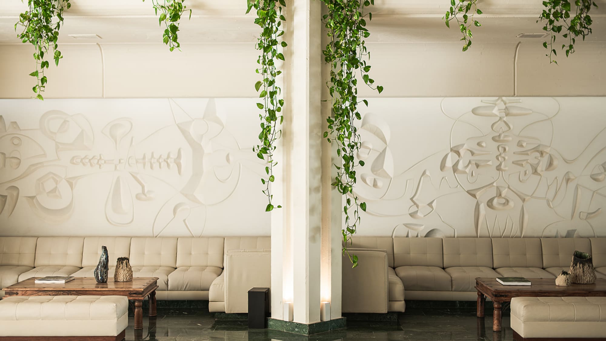 a room with couches and coffee tables