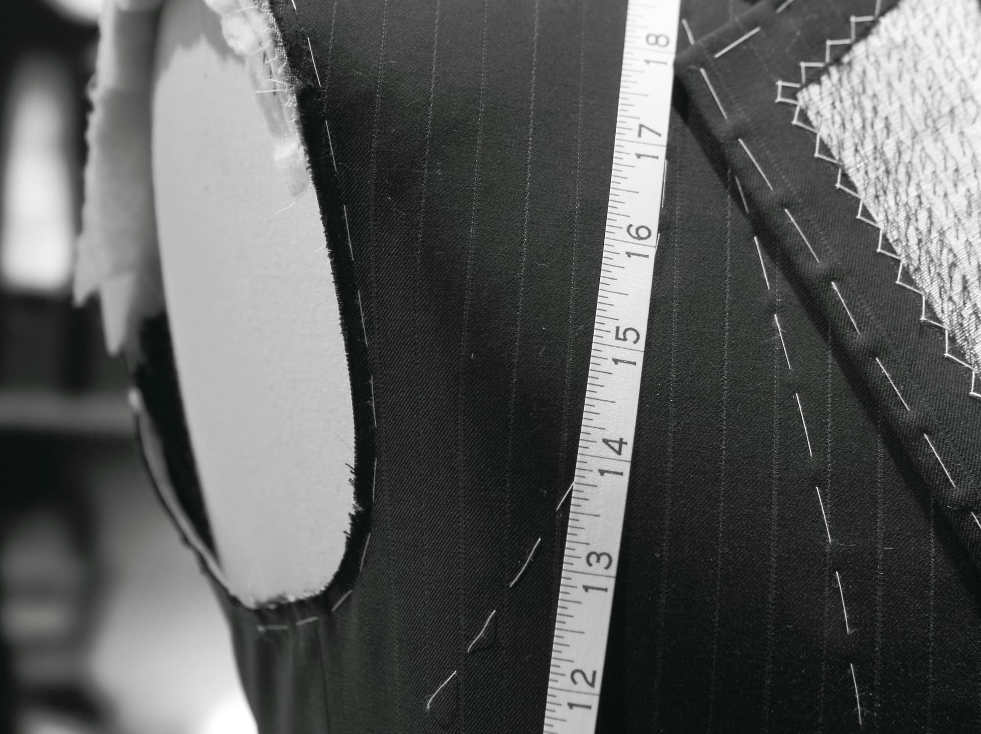 a mannequin with a measuring tape