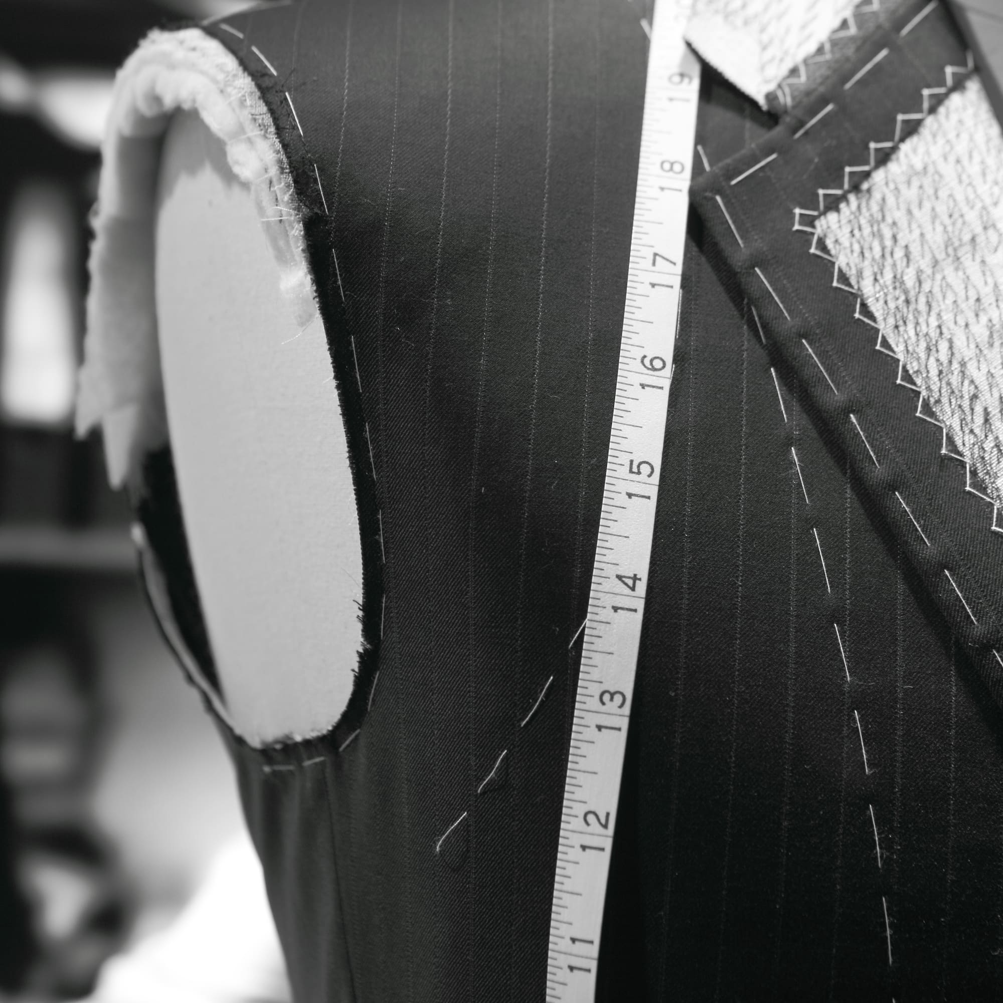 a mannequin with a measuring tape