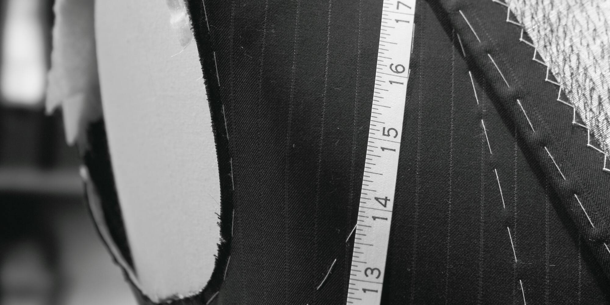 a mannequin with a measuring tape