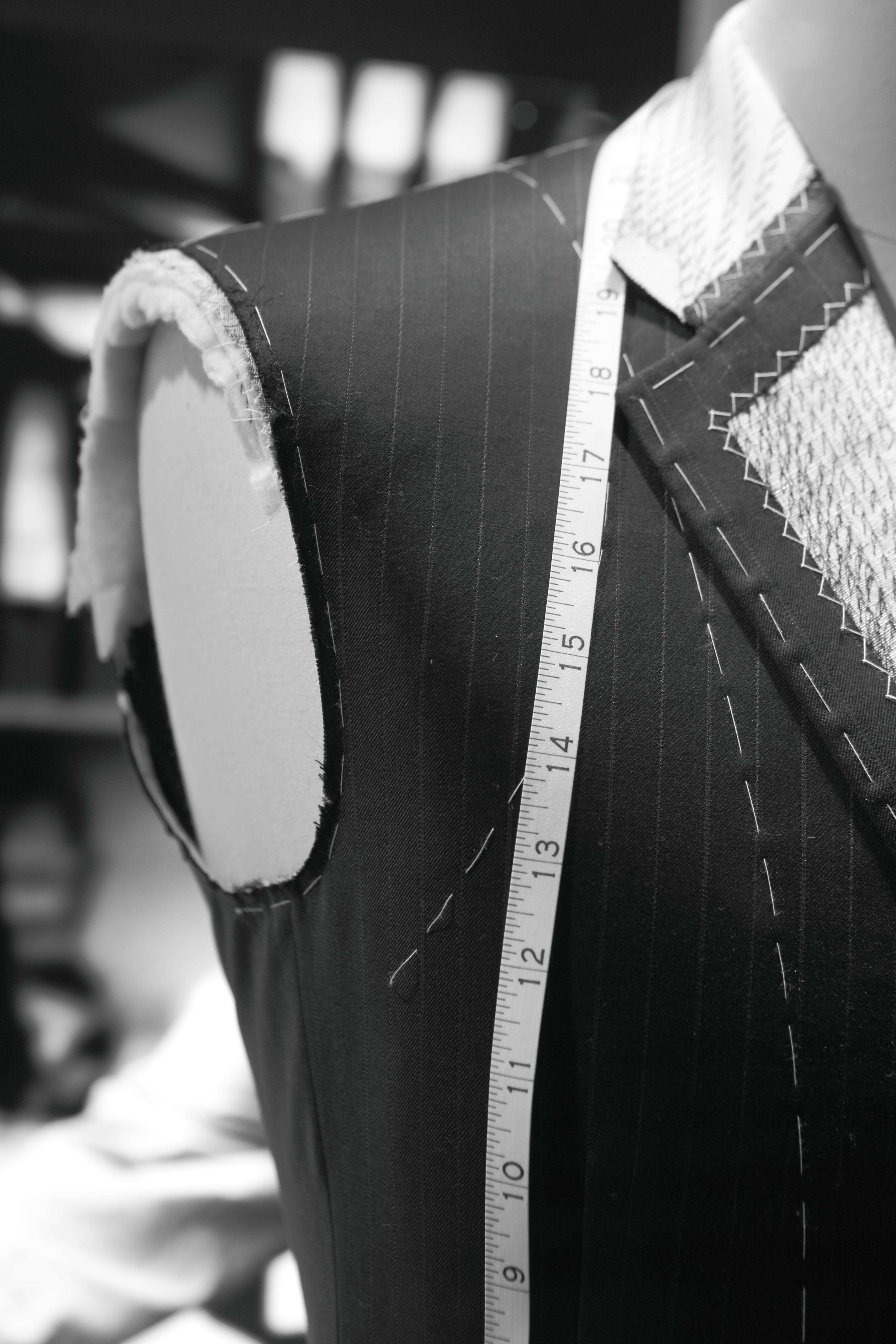 a mannequin with a measuring tape