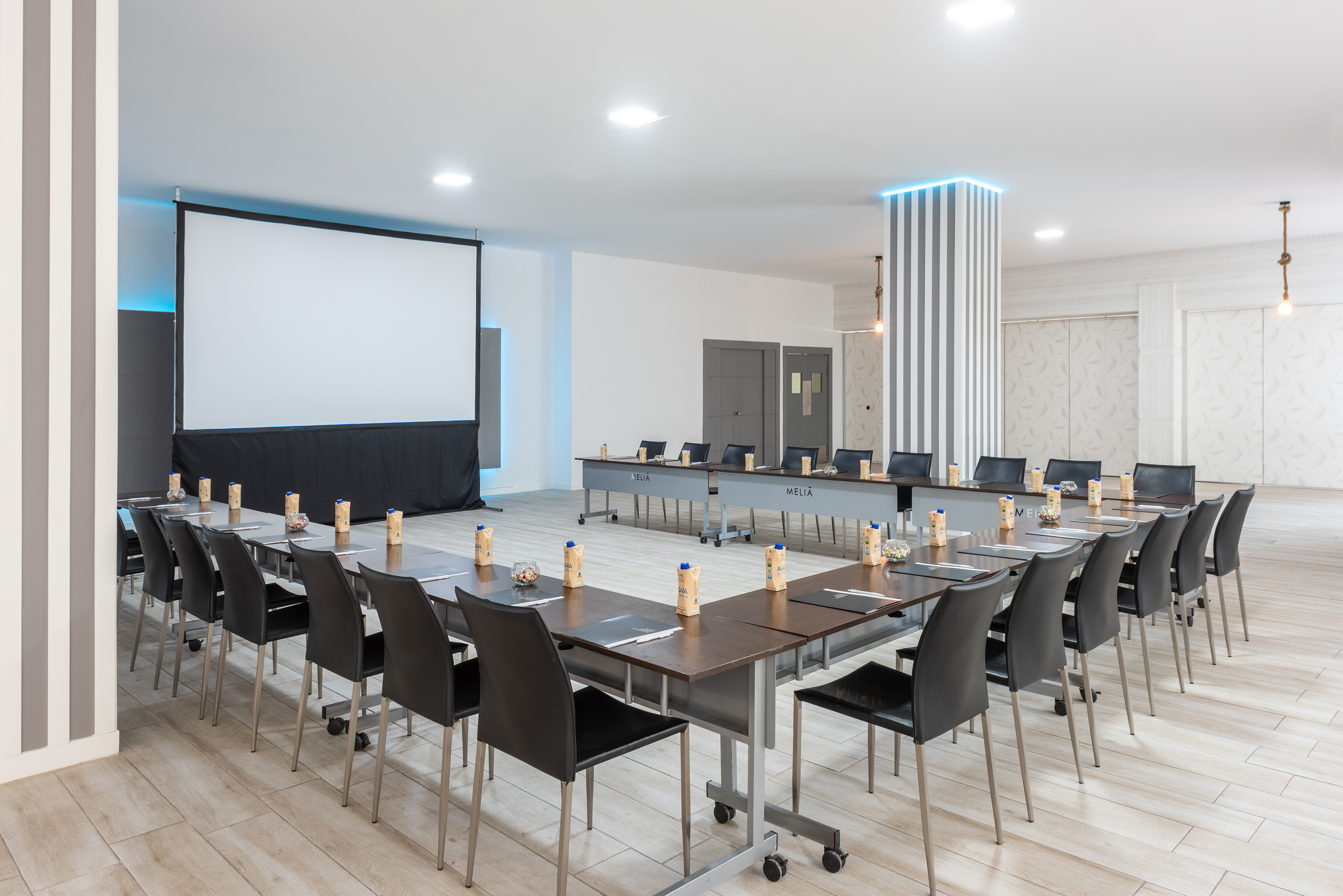 a room with a large table and chairs