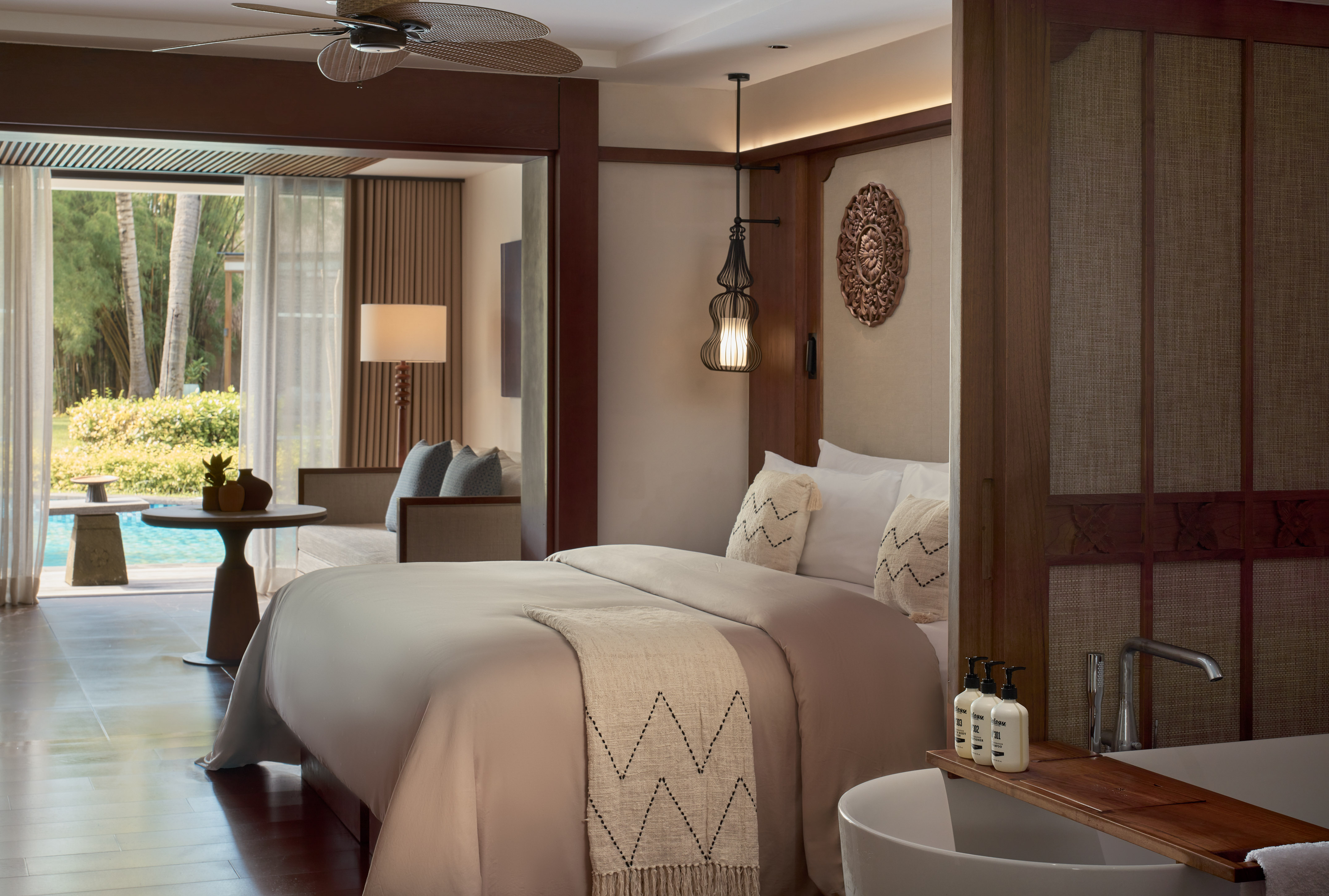 a room with a bed and a ceiling fan