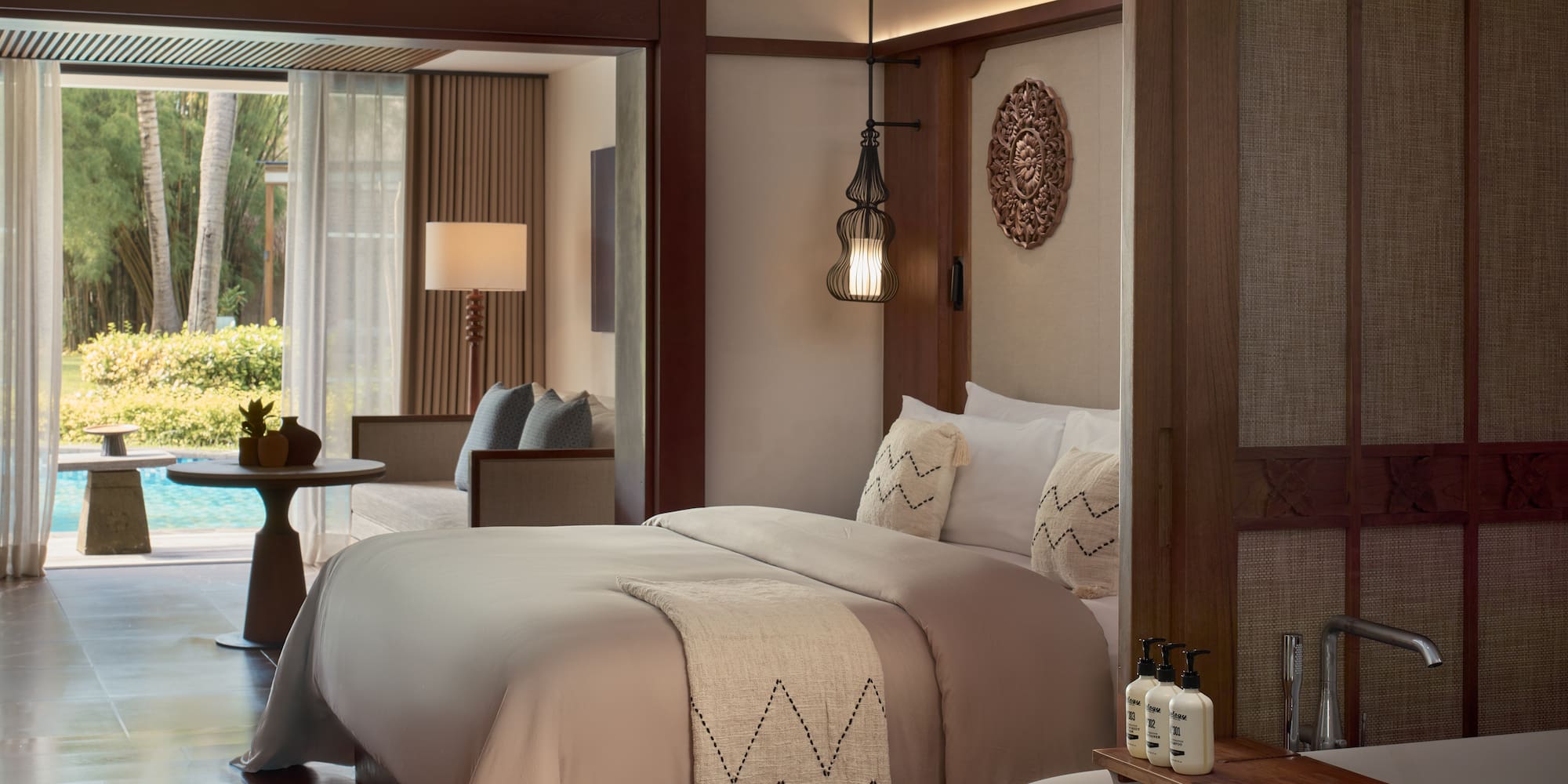 a room with a bed and a ceiling fan