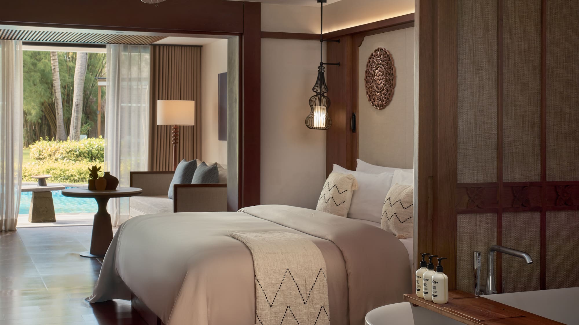 a room with a bed and a ceiling fan