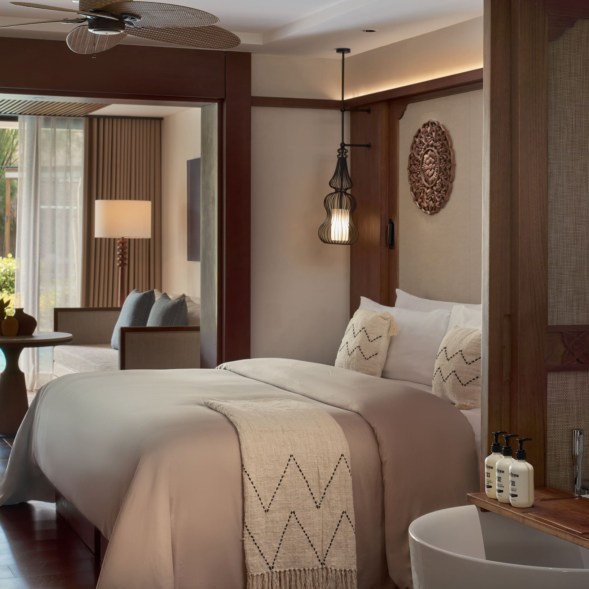 a room with a bed and a ceiling fan