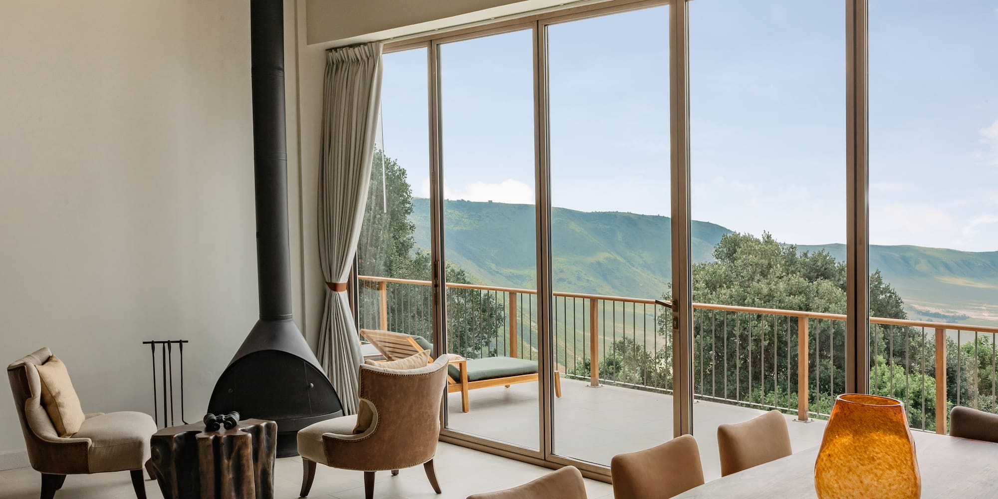 a room with a fireplace and chairs