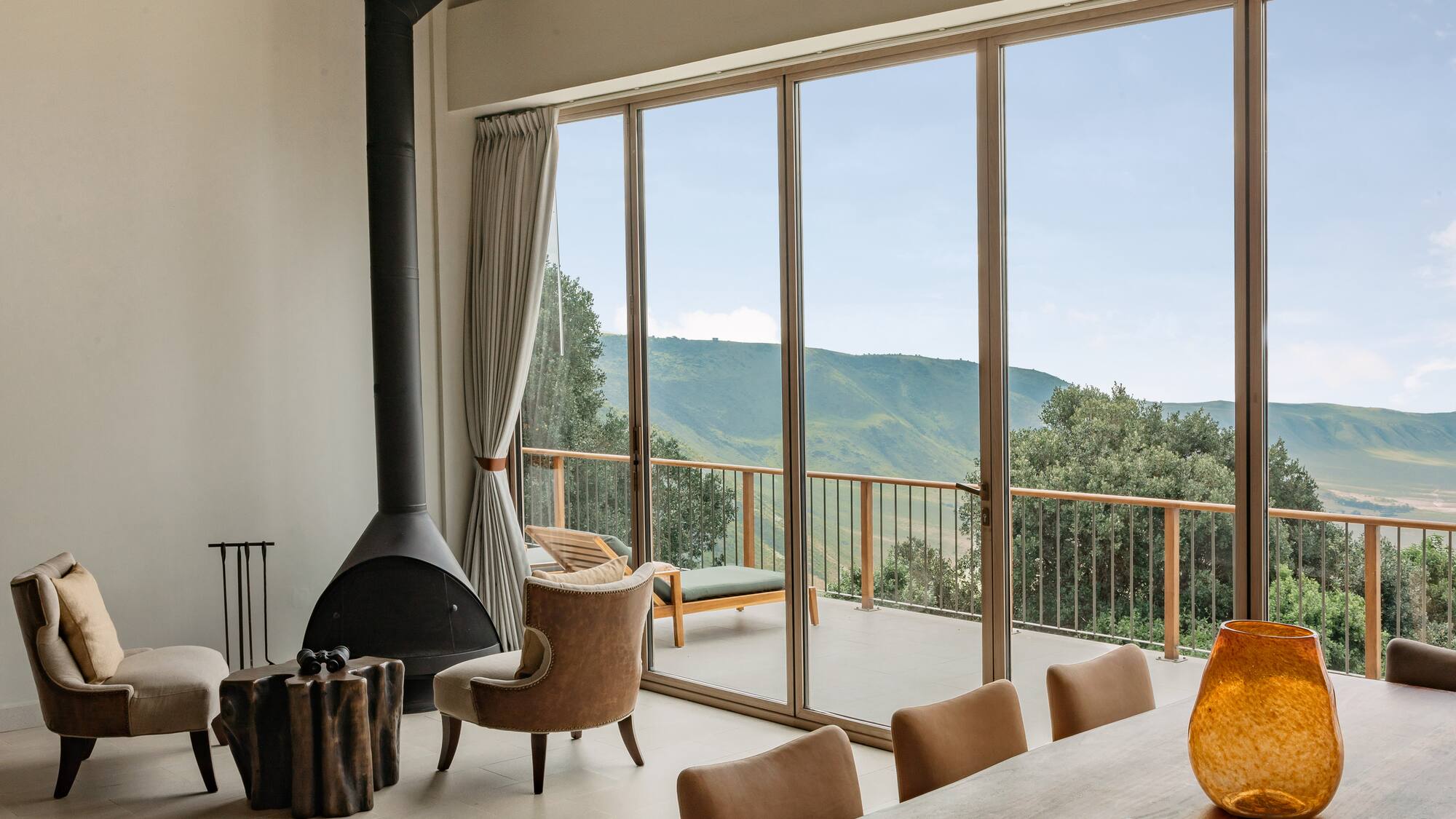 a room with a fireplace and chairs