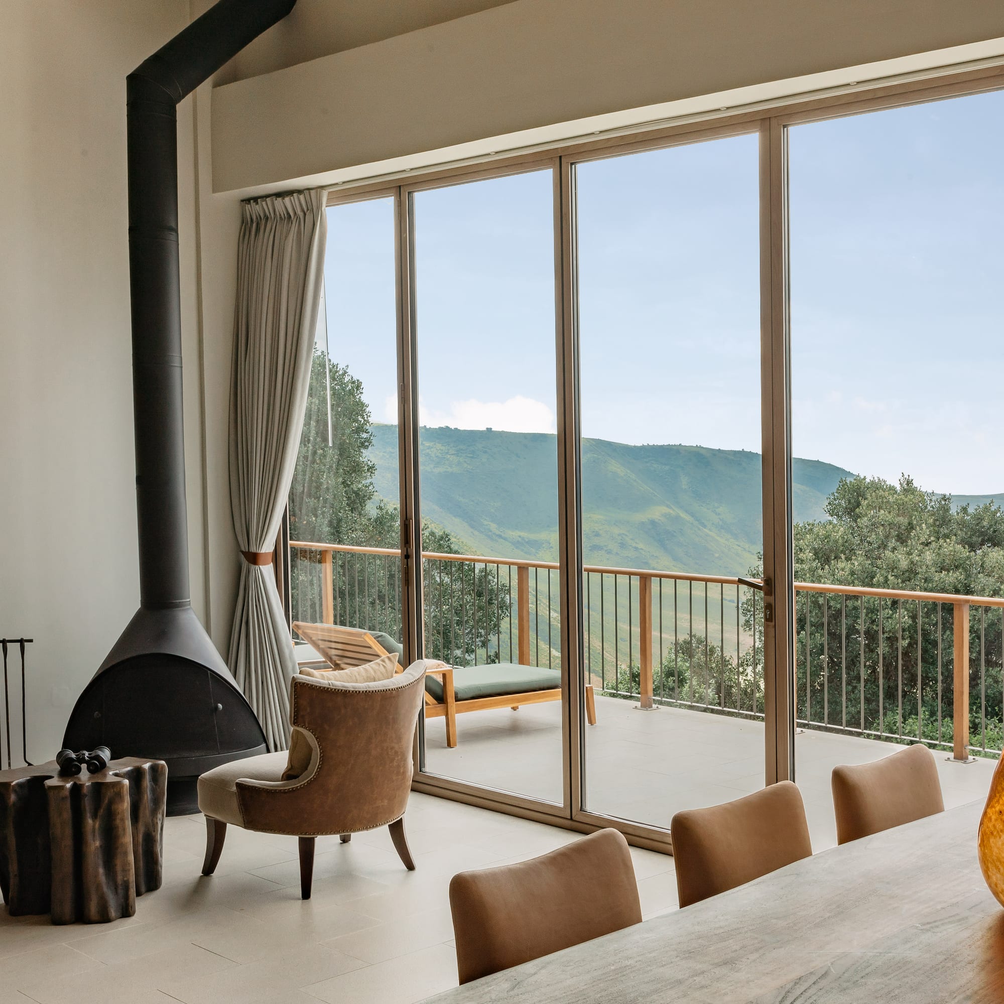 a room with a fireplace and chairs