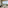 Safari lodge interior with fireplace and panoramic crater views.
