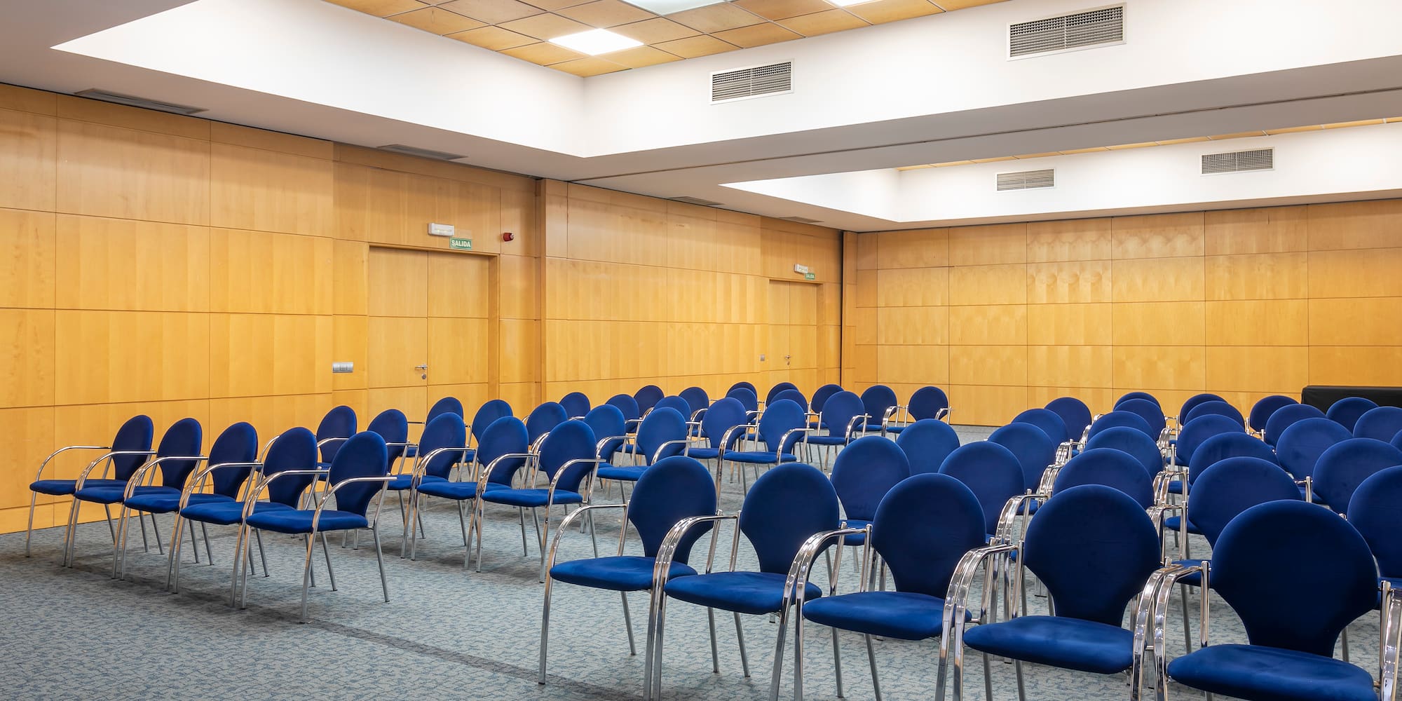 a room with blue chairs