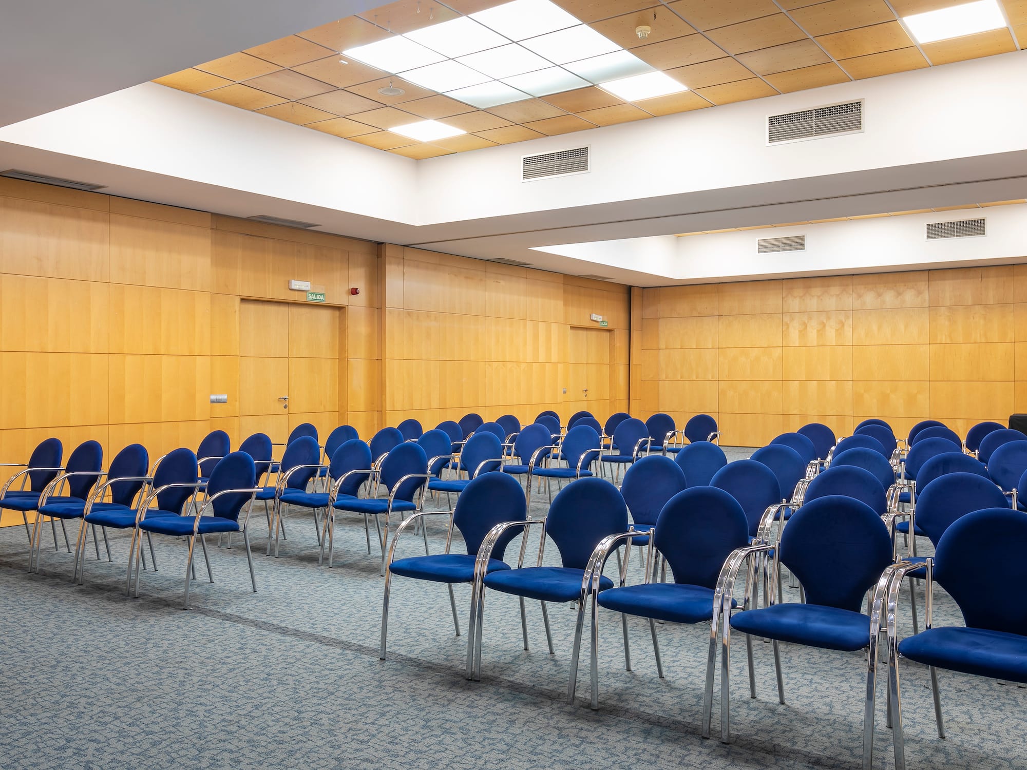 a room with blue chairs