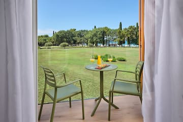a table and chairs outside a window