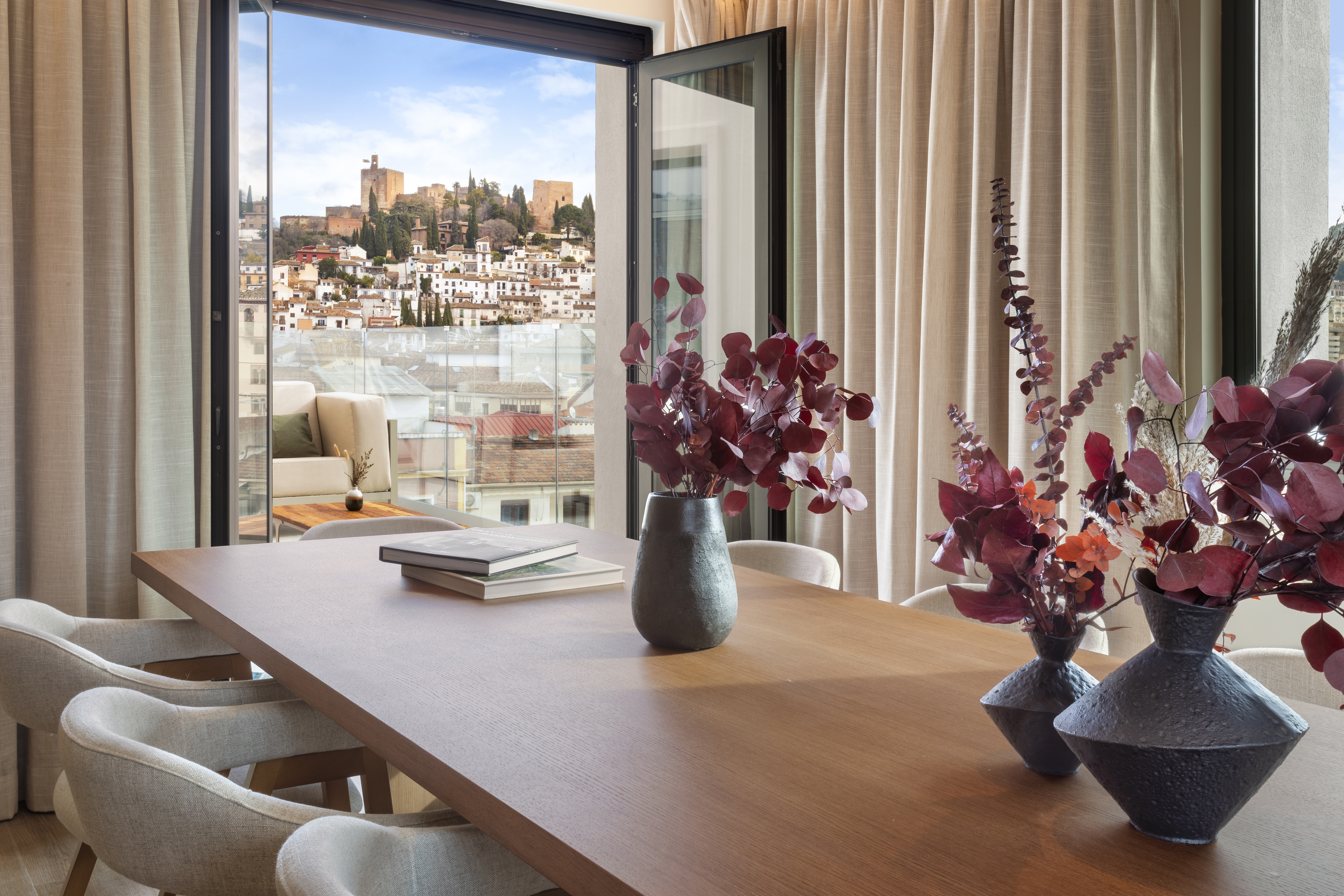 a table with vases and flowers on it