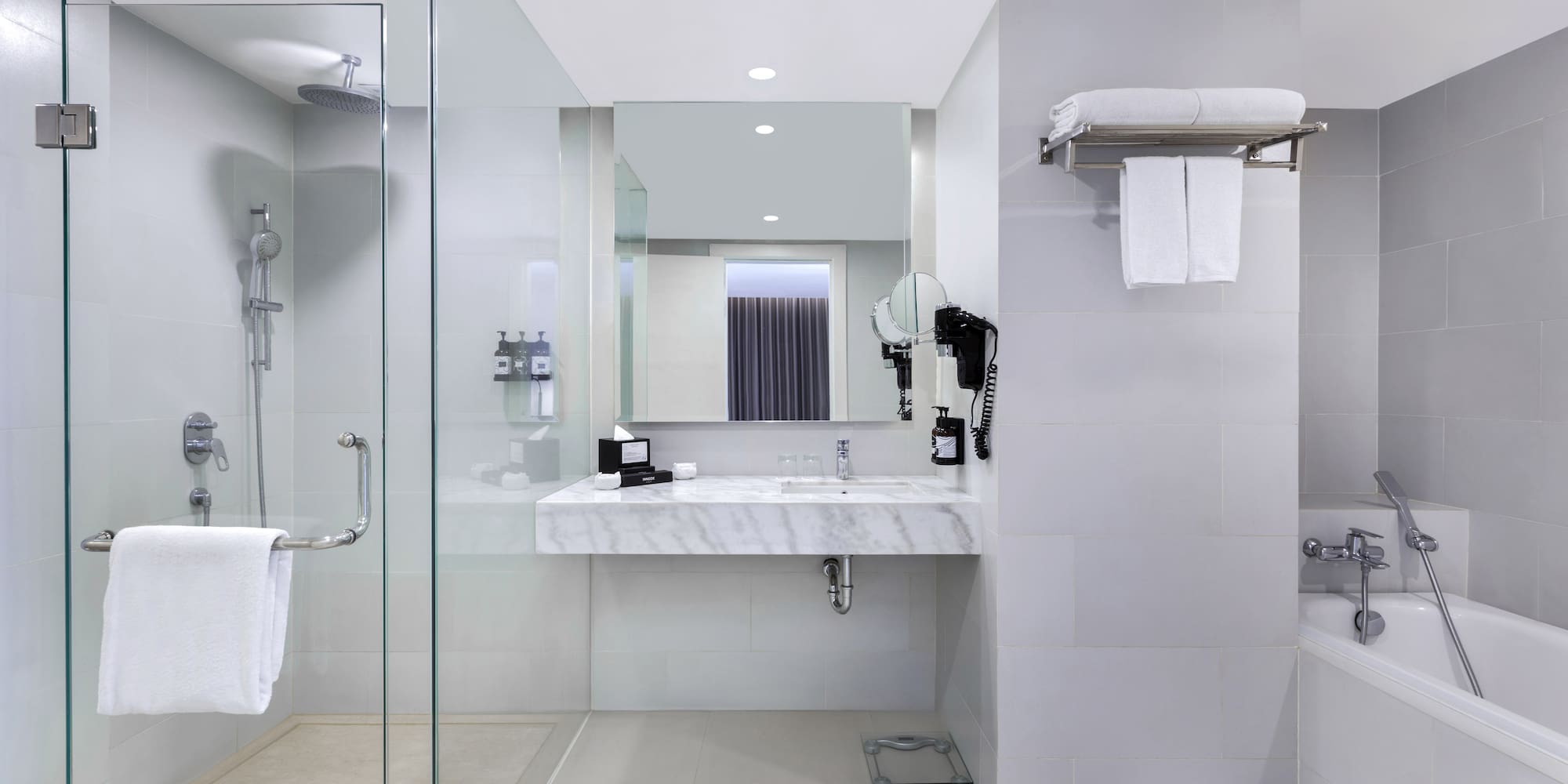 a bathroom with a shower and sink