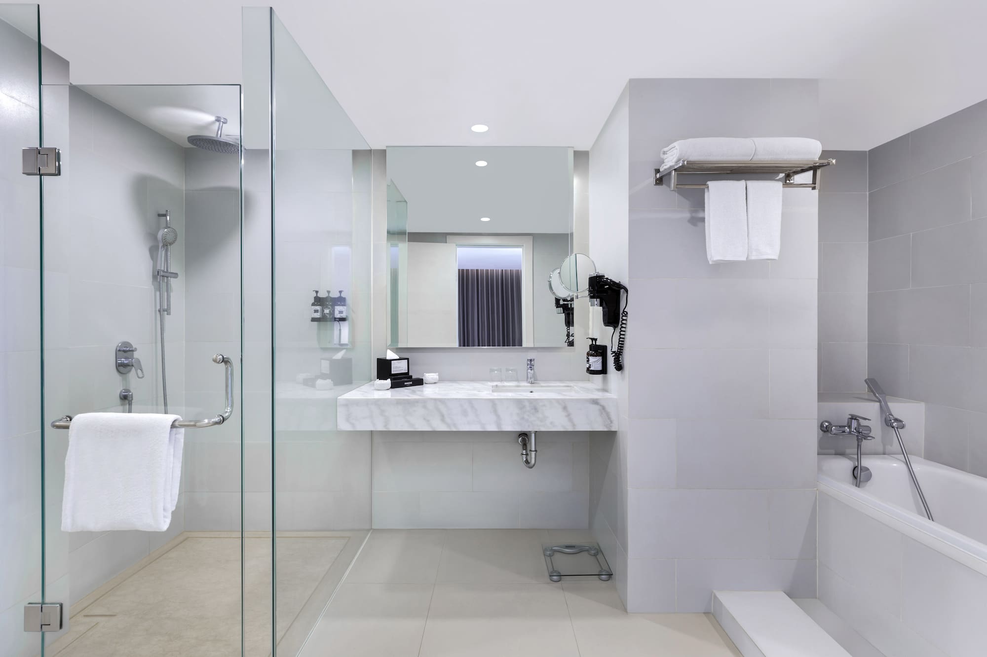 a bathroom with a shower and sink