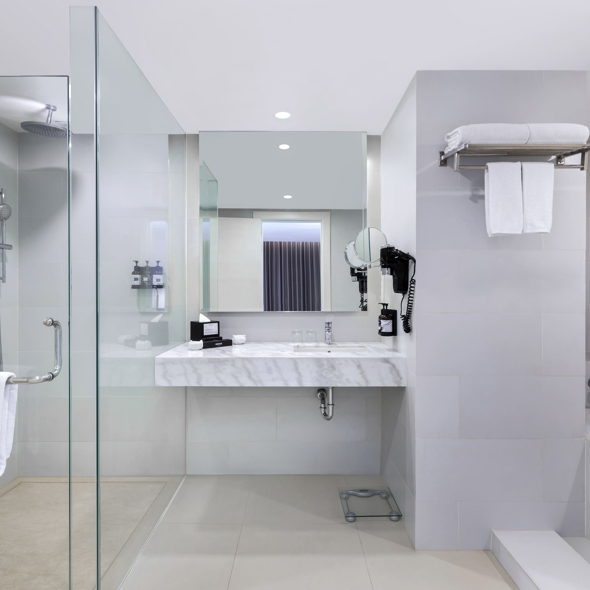 a bathroom with a shower and sink