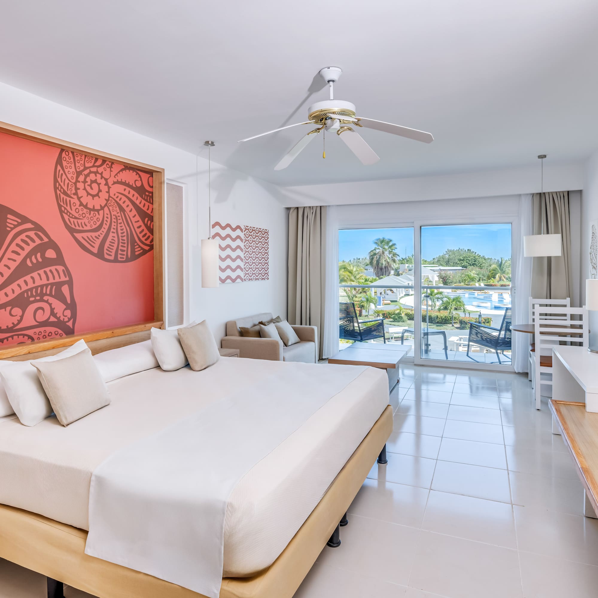 a room with a bed and a ceiling fan