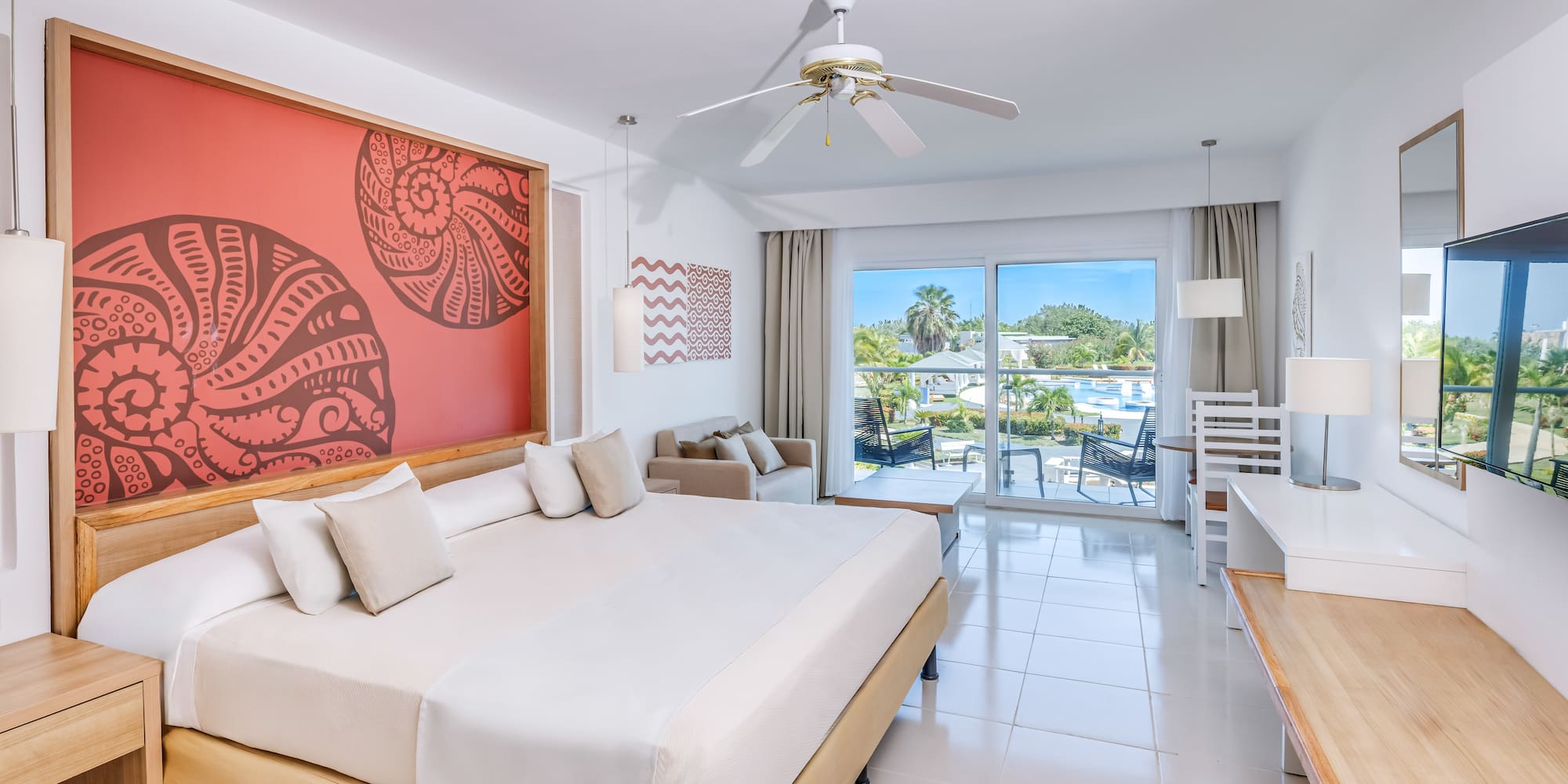 a room with a bed and a ceiling fan