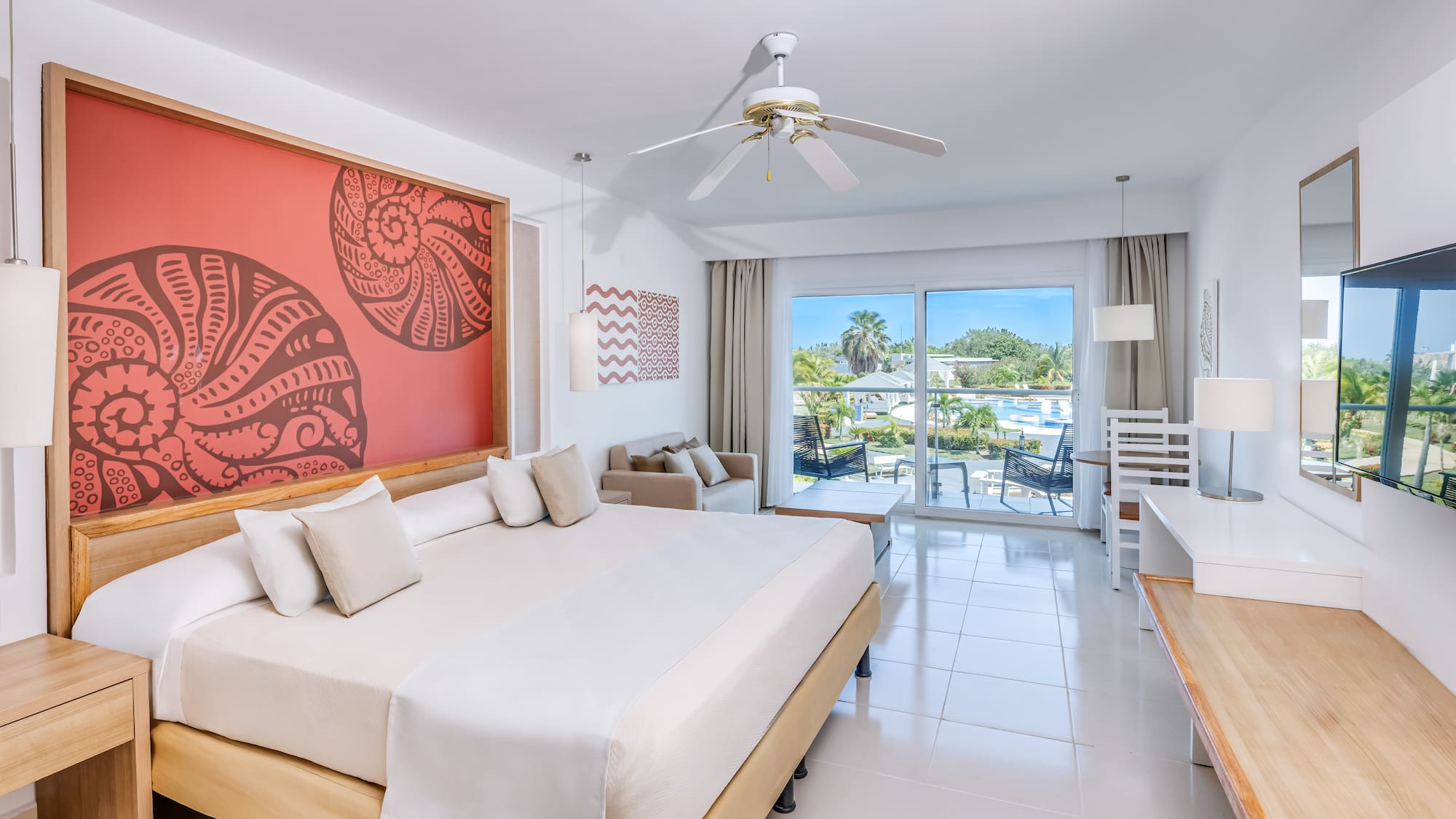 a room with a bed and a ceiling fan