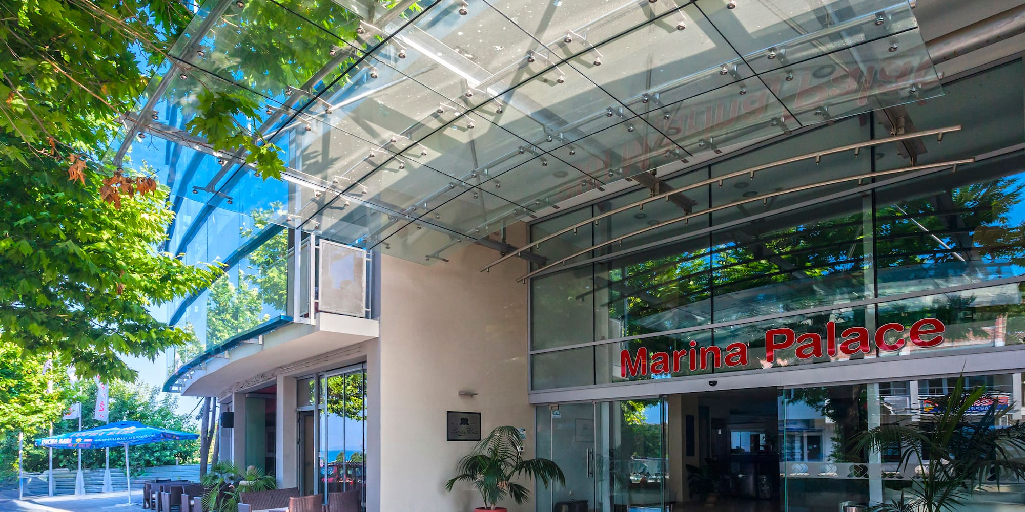 a glass building with a sign on the front