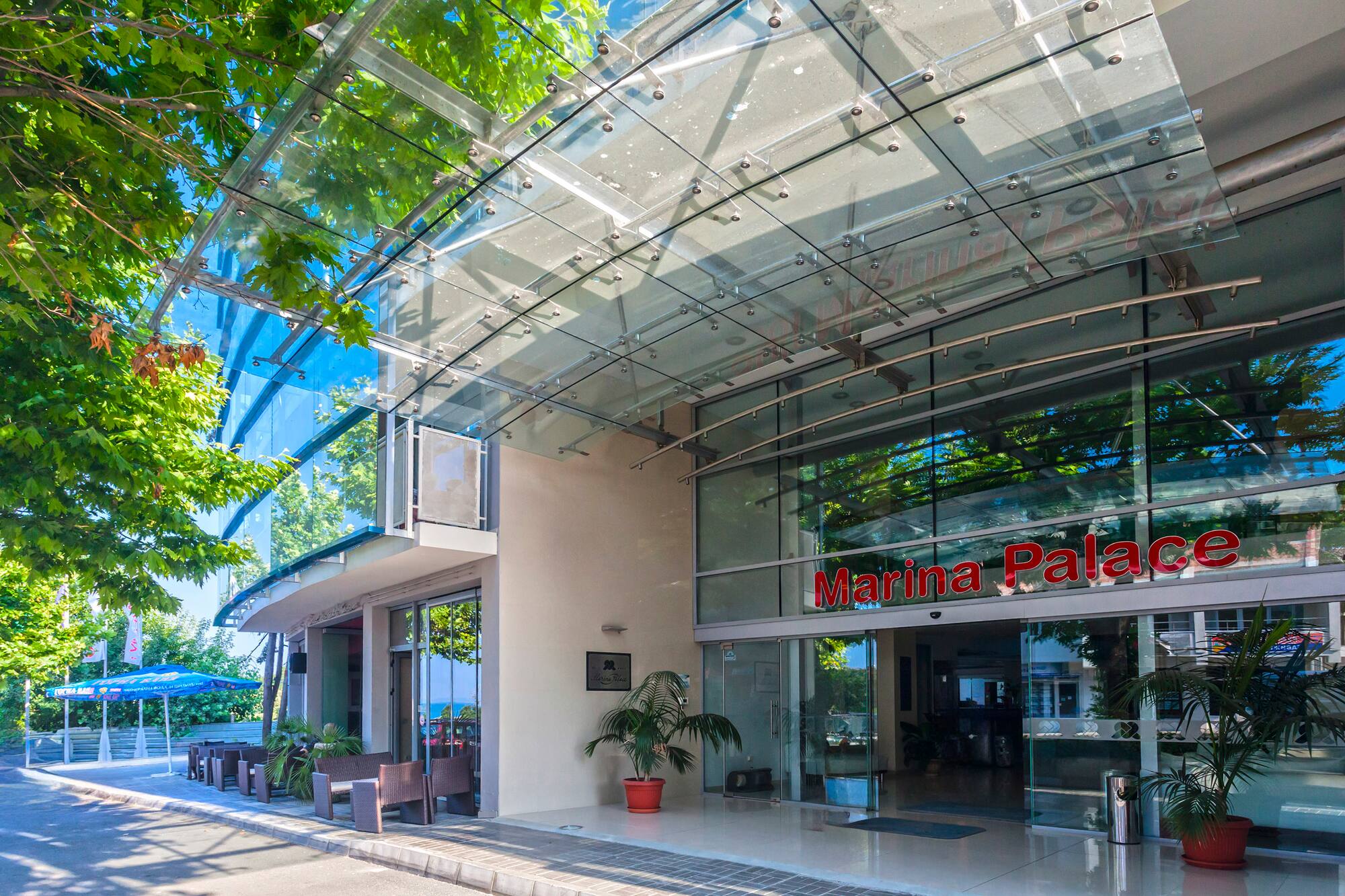 a glass building with a sign on the front