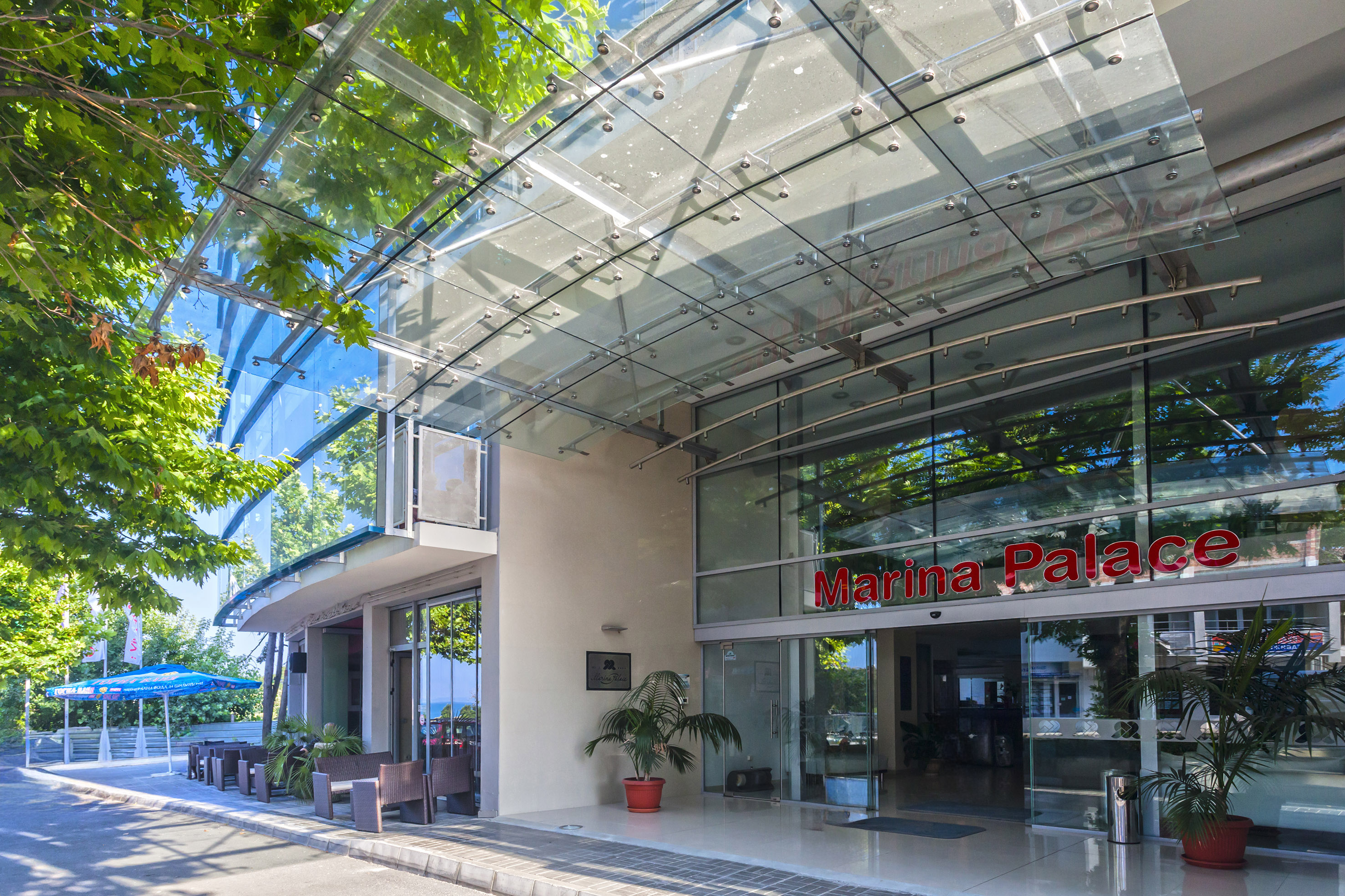 a glass building with a sign on the front