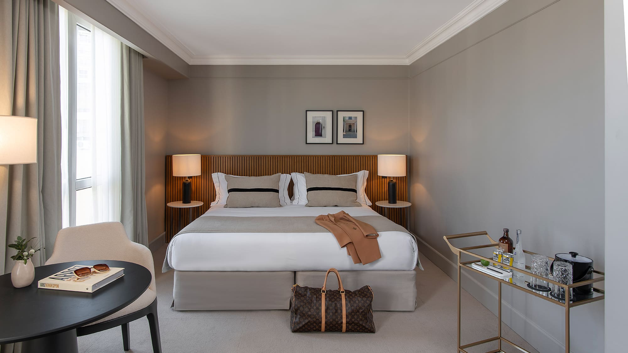 a bedroom with a bed and a table